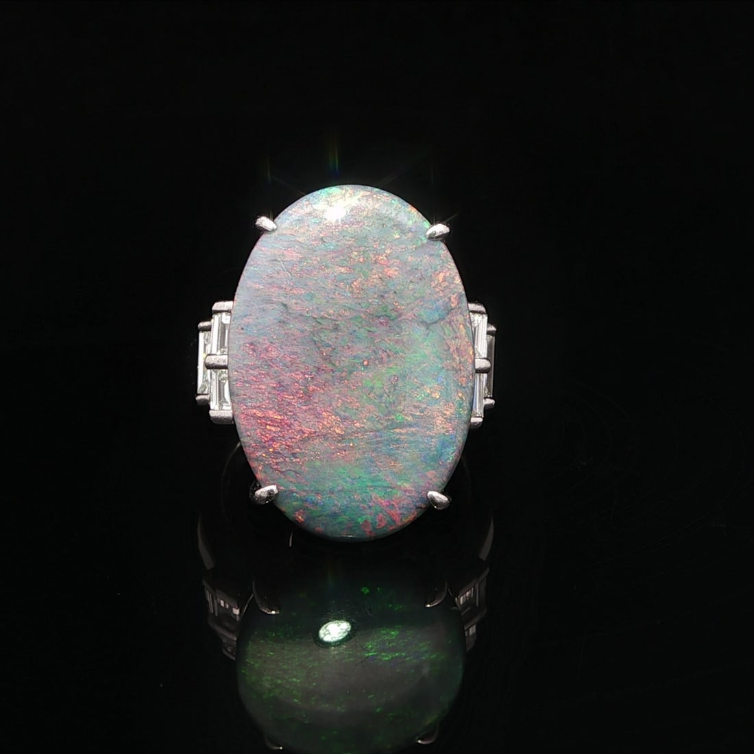 Vintage Platinum 13.64ctw GIA Red Orange Opal Diamond Cocktail Ring: Vintage Platinum 13.64ctw GIA Red Orange Opal Diamond Cocktail Ring Embrace the elegance of this vintage cocktail ring, featuring a stunning natural opal at its center. The ring showcases a large oval