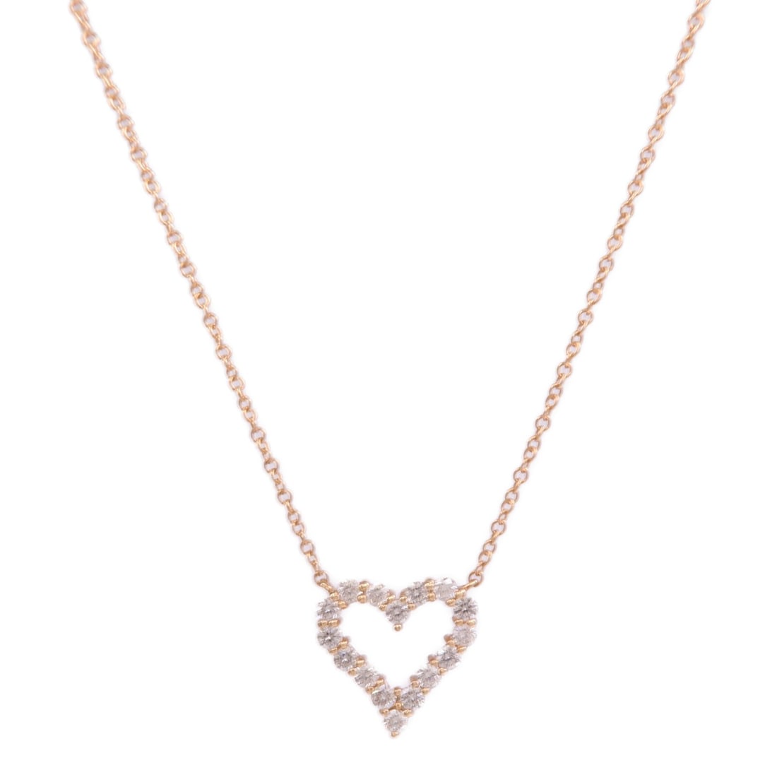Diamond Heart Pendant Necklace in 18K Rose Gold by TIFFANY&CO: Diamond Heart Pendant Necklace in 18K Rose Gold by TIFFANY&CO This Tiffany & Co. heart pendant necklace features a delicate design crafted in 18K rose gold and is adorned with a diamond. Made in the U