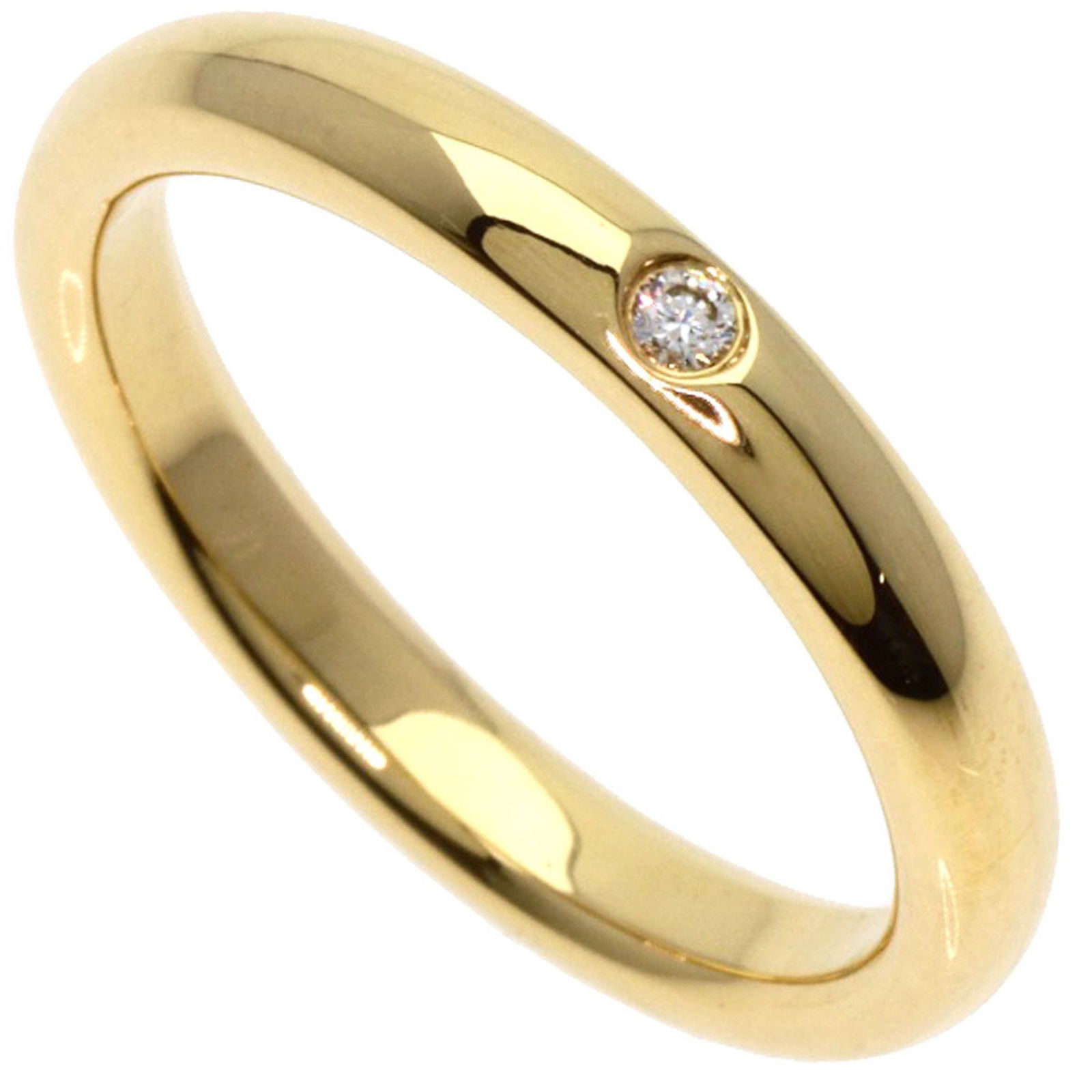 Yellow gold stacking ring by Tiffany & Co model for women: Yellow gold stacking ring by Tiffany & Co model for women This Tiffany & Co. stacking band is crafted from yellow gold and designed for women. The band is size 5 and features a polished finish with sl