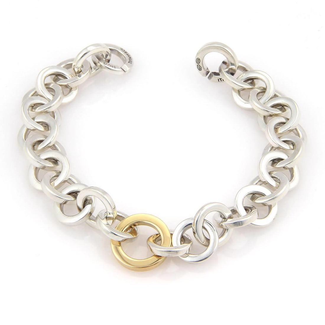 Tiffany & Co. Sterling Silver 18k Yellow Gold Circle Link Bracelet: Tiffany & Co. Sterling Silver 18k Yellow Gold Circle Link Bracelet This exquisite bracelet from Tiffany & Co. is expertly crafted from sterling silver and 18k yellow gold, showcasing a high polished f