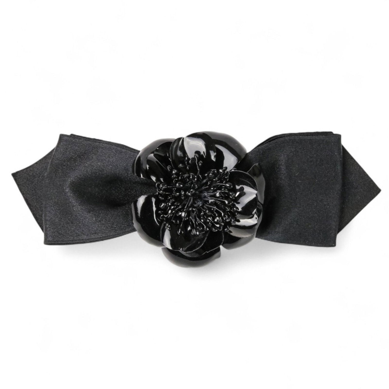 Black Synthetic Camellia Model Accessory by Chanel 7cm x 20cm: Black Synthetic Camellia Model Accessory by Chanel 7cm x 20cm This Chanel Camellia is a women's accessory crafted from synthetic material in black. It features the iconic Camellia motif and is made in