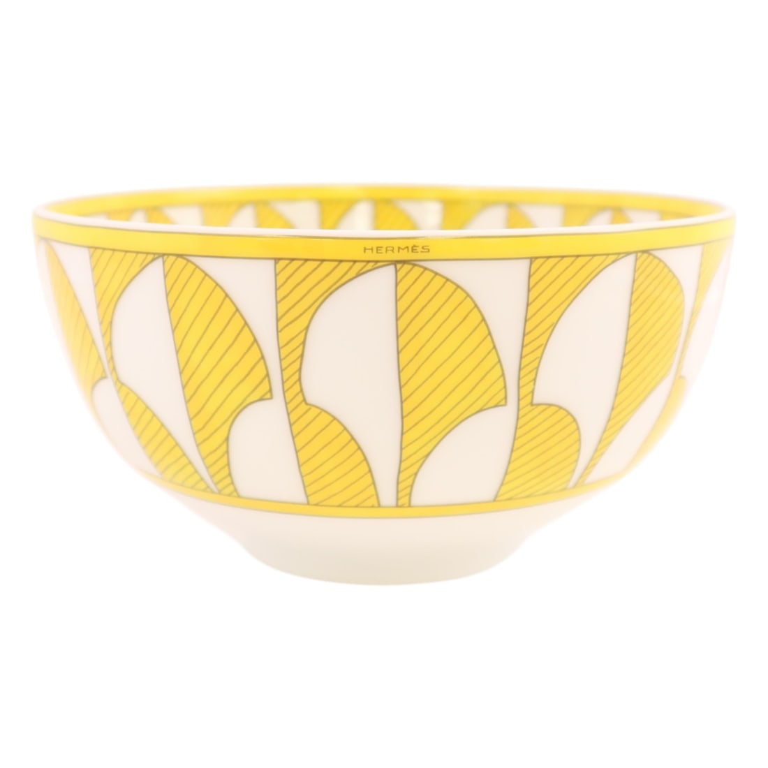 Porcelain Medium Bowl in Soleil d'Hermes Yellow and White: Porcelain Medium Bowl in Soleil d'Hermes Yellow and White This is a Soleil d'Hermes medium model bowl crafted from porcelain in a striking yellow and white color combination. Made in France, this tabl