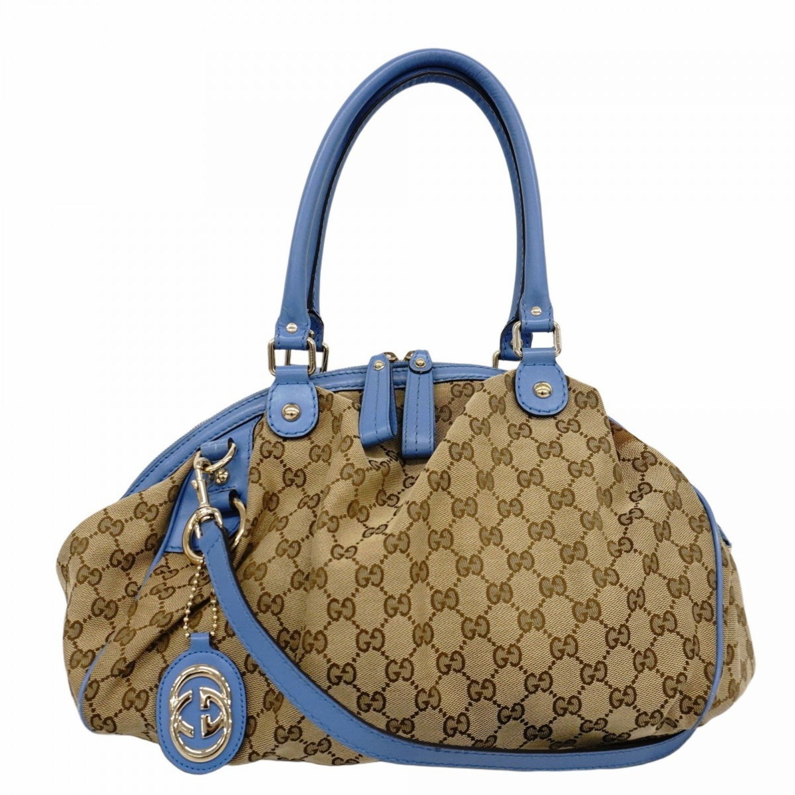 Brown Gucci GG Canvas Tote Bag with Italian Craftsmanship: Brown Gucci GG Canvas Tote Bag with Italian Craftsmanship This Gucci GG Canvas bag features a classic brown canvas exterior with the iconic GG pattern. Designed for women, it offers a spacious interio