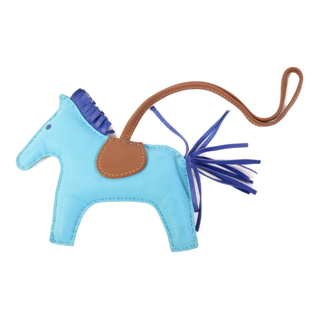 HERMES Rodeo MM Charm Blue Brown Lambskin Leather: HERMES Rodeo MM Charm Blue Brown Lambskin Leather This HERMES Rodeo MM Charm is a stylish accessory crafted from high-quality lambskin leather. The charm features a beautiful blue color, making it a p