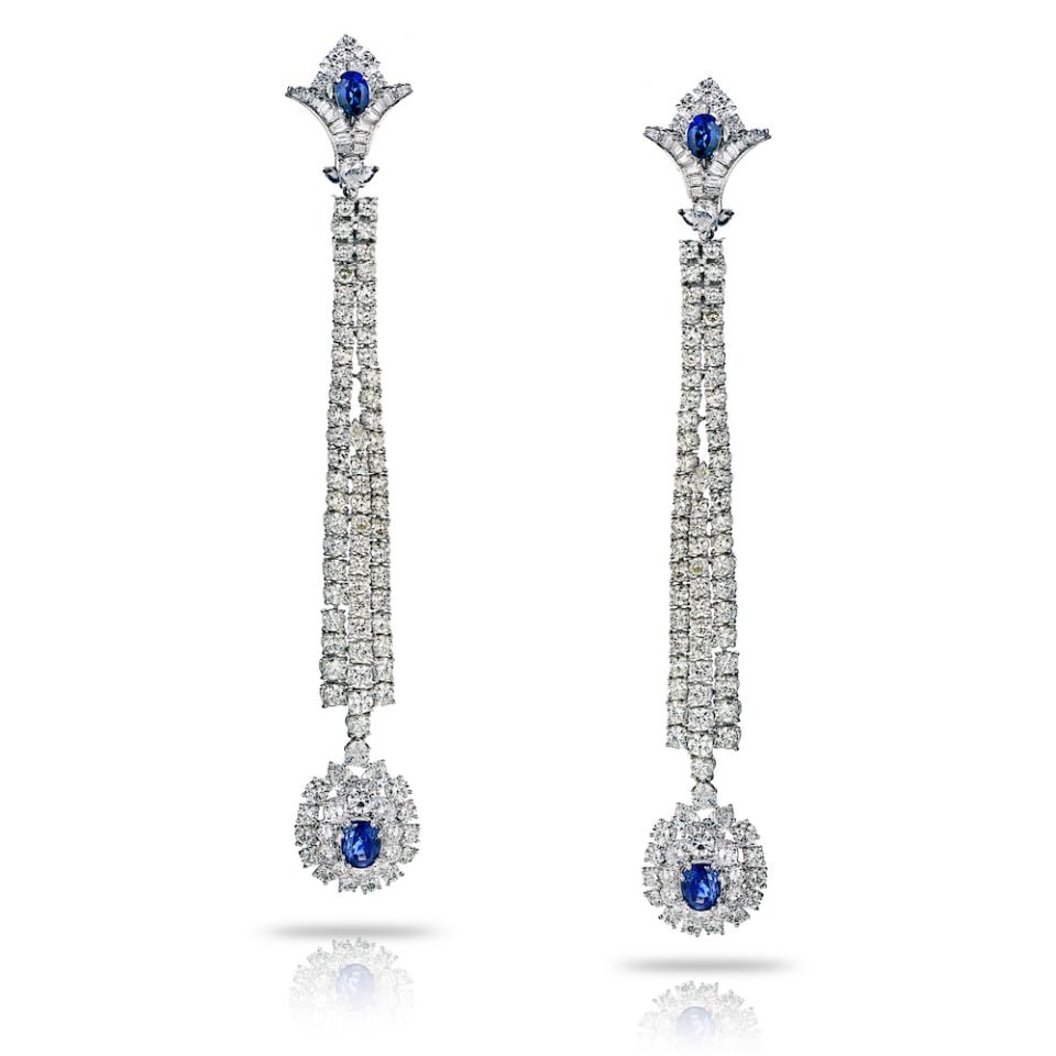 Jahan 18K White Gold 23Cts Diamond Sapphire Long Earrings: Jahan 18K White Gold 23Cts Diamond Sapphire Long Earrings Elevate your evening ensemble with these stunning long dangle earrings, expertly crafted in 18K white gold. Featuring a remarkable total diamo
