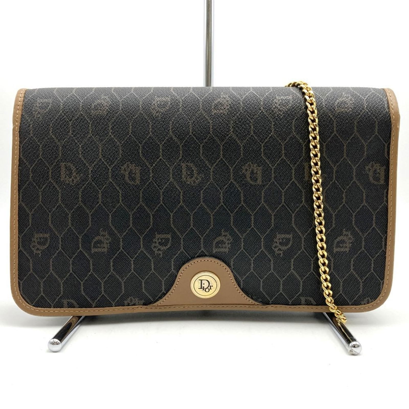 Brown Canvas Dior Honeycomb Shoulder Bag with 90cm Strap: Brown Canvas Dior Honeycomb Shoulder Bag with 90cm Strap This Dior Honeycomb handbag features a brown canvas exterior, designed for women. The bag originates from France and is crafted with attention