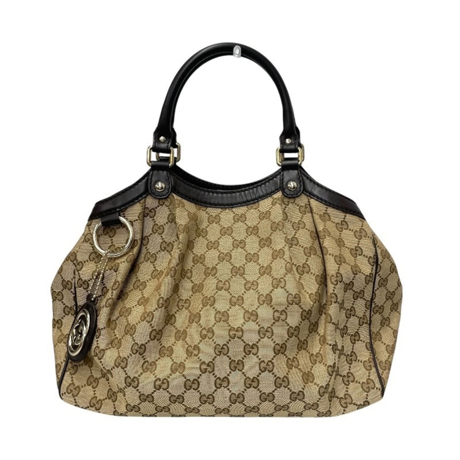Beige Brown Canvas Leather Gucci Sukey Bag for Women: Beige Brown Canvas Leather Gucci Sukey Bag for Women The Gucci Sukey is a women's handbag crafted from beige and brown canvas with leather accents. Made in Italy, this bag features a spacious interior