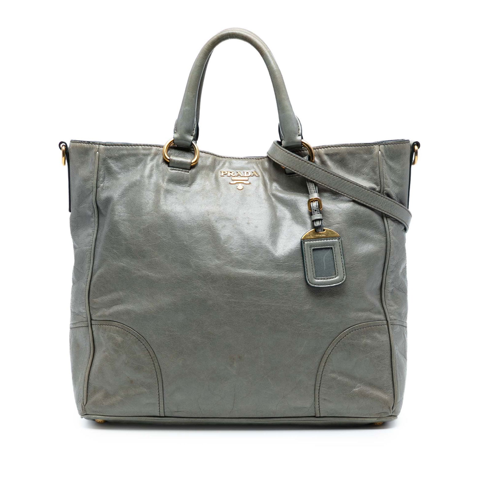 Prada Vitello Shine Gray Leather Satchel with Repainted Handles: Prada Vitello Shine Gray Leather Satchel with Repainted Handles Elevate your accessory collection with the Prada Vitello Shine Satchel, crafted in luxurious leather with a sleek gray finish. This chic