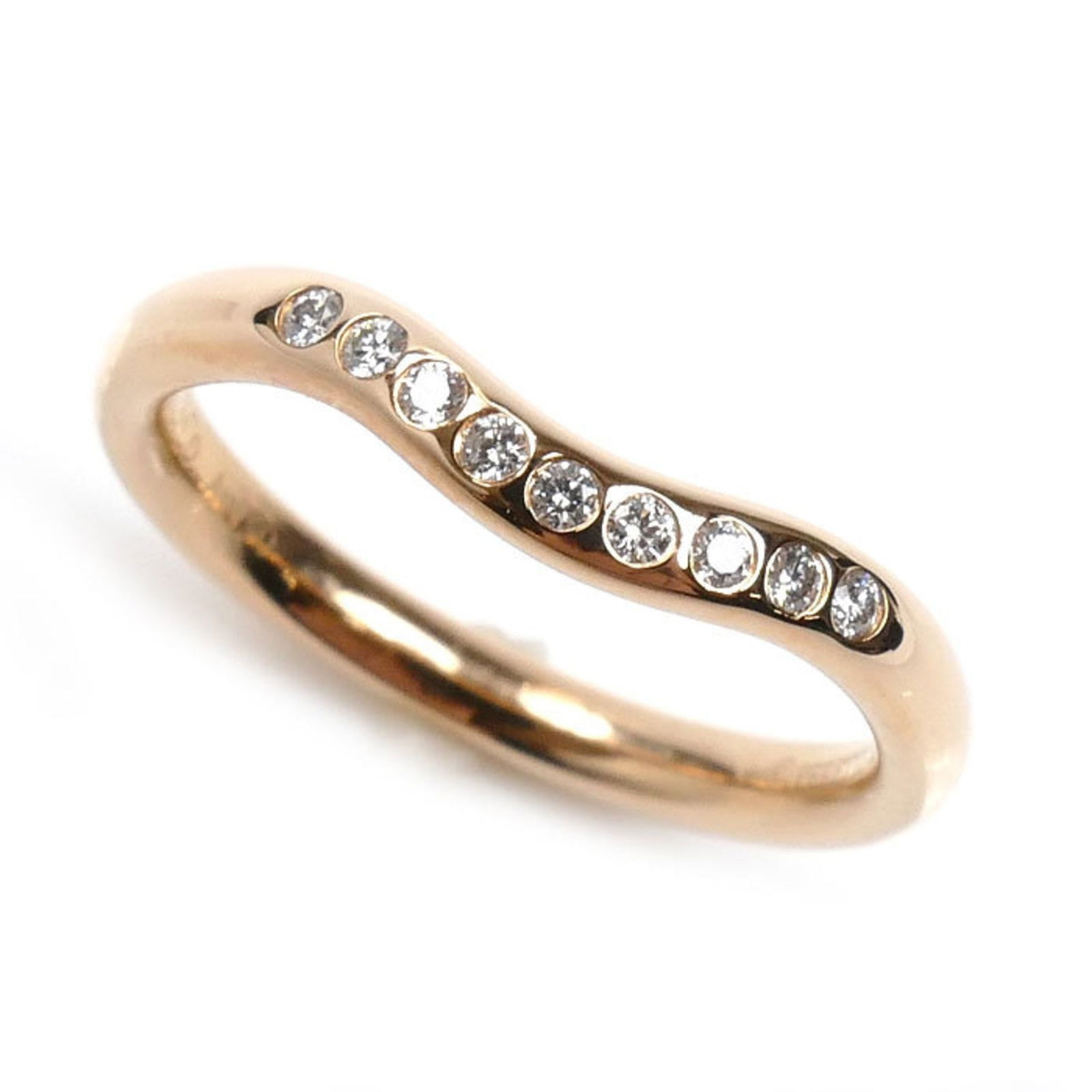Rose Gold Curved Diamond Band by Tiffany & Co: Rose Gold Curved Diamond Band by Tiffany & Co This Tiffany & Co. Curved band features a sleek rose gold design accented with a diamond. The ring is in good condition with minor scratches on the main b