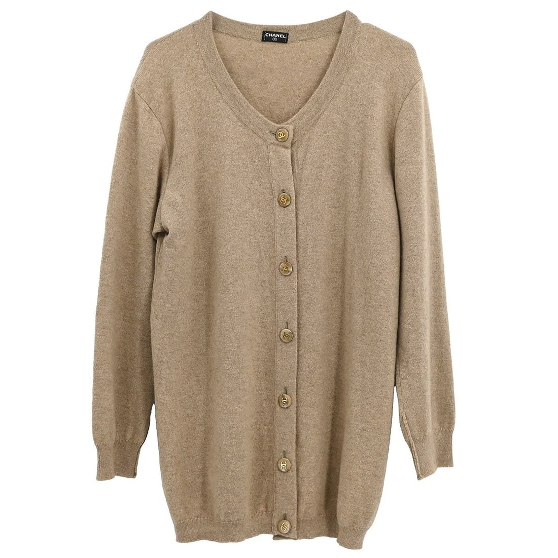 Chanel Vintage Beige Knit Cardigan with Button Accents: Chanel Vintage Beige Knit Cardigan with Button Accents This elegant Chanel Cardigan in a soft beige hue is perfect for casual occasions. It features long sleeves, a regular fit, and stylish button acc