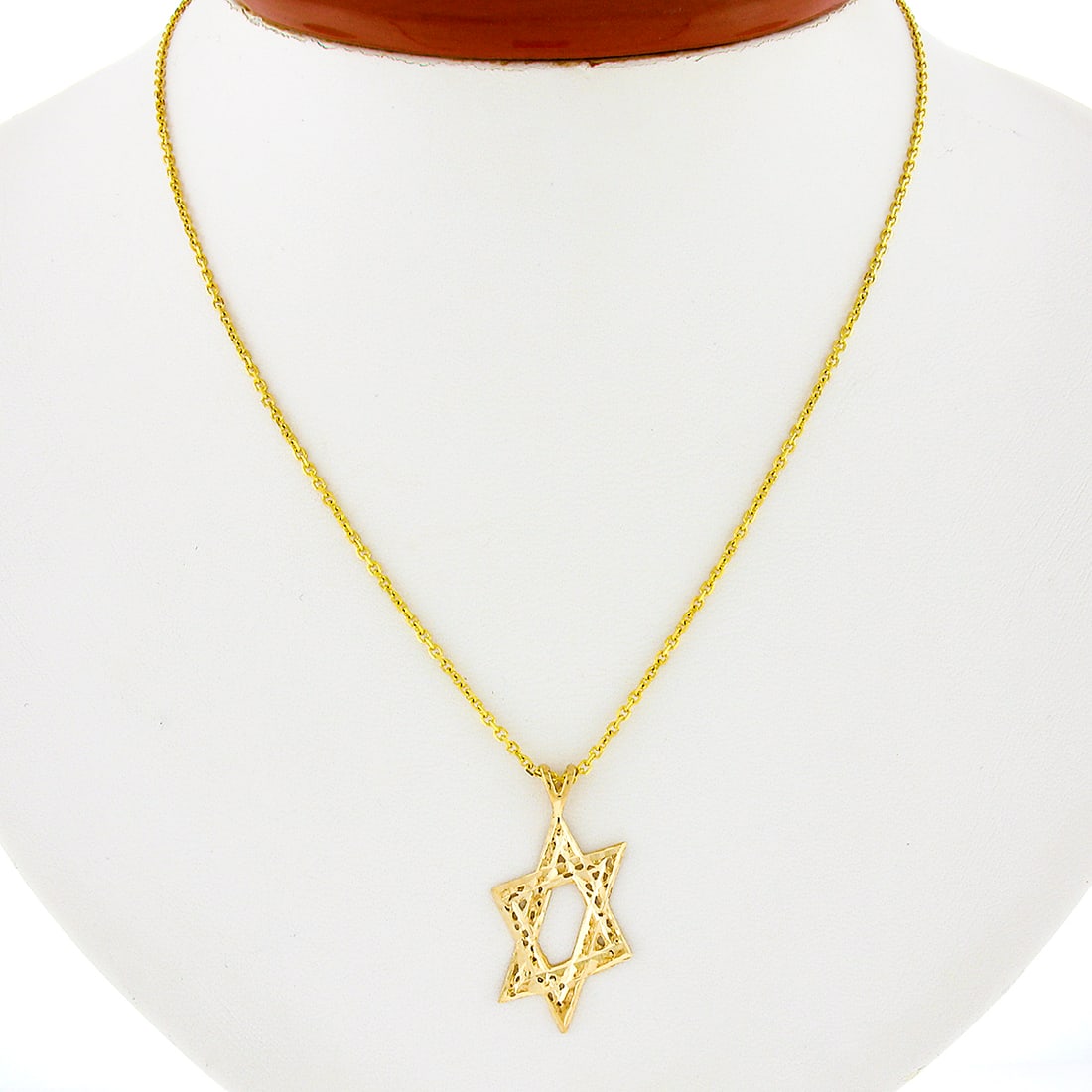14K Yellow Gold Textured Star of David Pendant with 18 Inch Chain: 14K Yellow Gold Textured Star of David Pendant with 18 Inch Chain This exquisite pendant necklace features a beautifully textured Star of David design, crafted from solid 14K yellow gold. The open wor