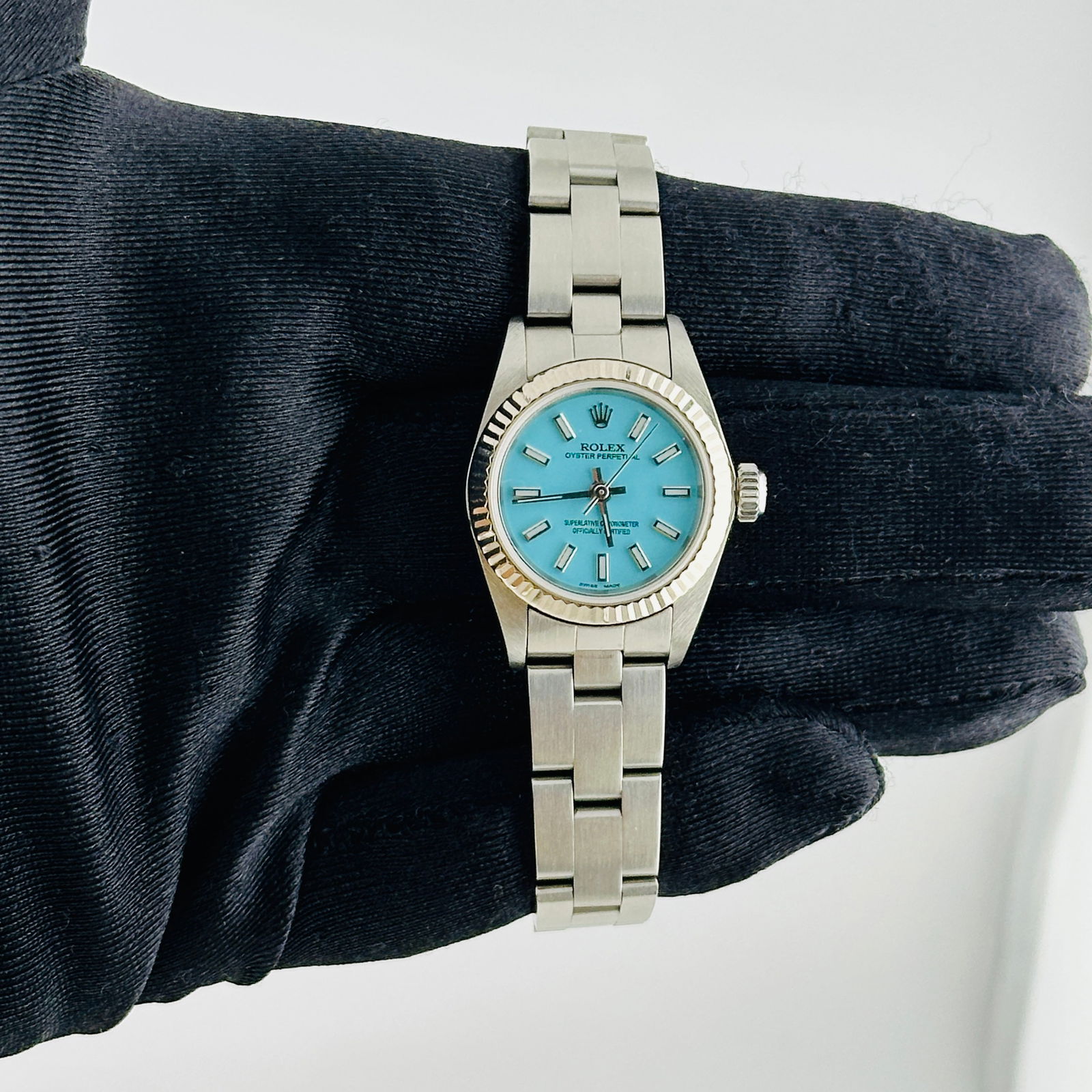 Ladies Rolex Ref 76094 Aftermarket Tiffany Dial Oyster Perpetual Watch: Ladies Rolex Ref 76094 Aftermarket Tiffany Dial Oyster Perpetual Watch This Rolex Oyster Perpetual features an aftermarket Tiffany dial and is designed for ladies. The watch is part of the Oyster Perp
