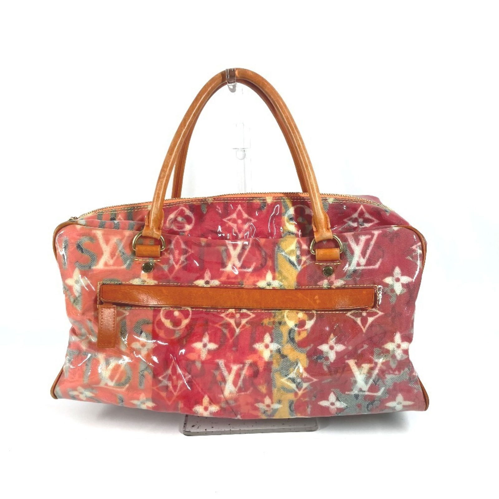 Richard Prince Multicolour Vinyl Handbag by Louis Vuitton: Richard Prince Multicolour Vinyl Handbag by Louis Vuitton This Louis Vuitton Richard Prince handbag is crafted from multicolored vinyl and features a contemporary design. Made in France, it offers a s