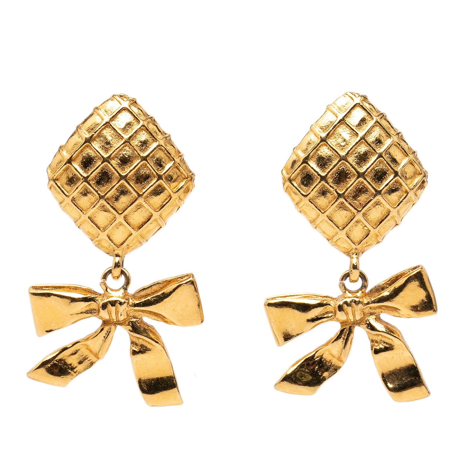 Chanel Ribbon Clip Earrings with Gold Plated Quilted Diamond Design: Chanel Ribbon Clip Earrings with Gold Plated Quilted Diamond Design These Chanel clip-on earrings feature a gold plated metal construction with a quilted diamond ribbon design. They have a push back c
