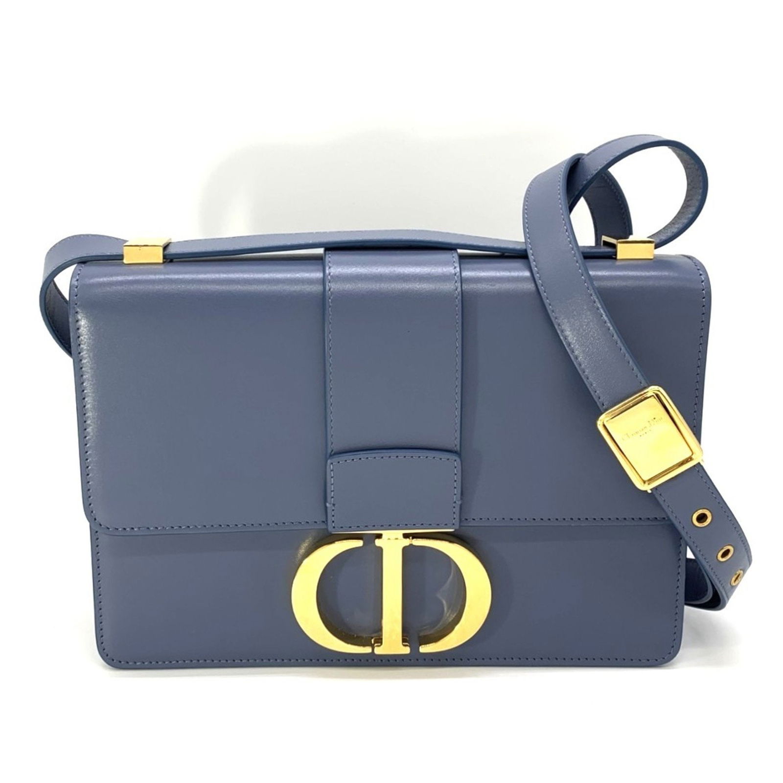 Blue Leather Dior 30 Montaigne Handbag Made in Italy: Blue Leather Dior 30 Montaigne Handbag Made in Italy This Dior 30 Montaigne handbag is crafted from blue leather and features a structured silhouette. Designed for women, it is made in Italy and offer