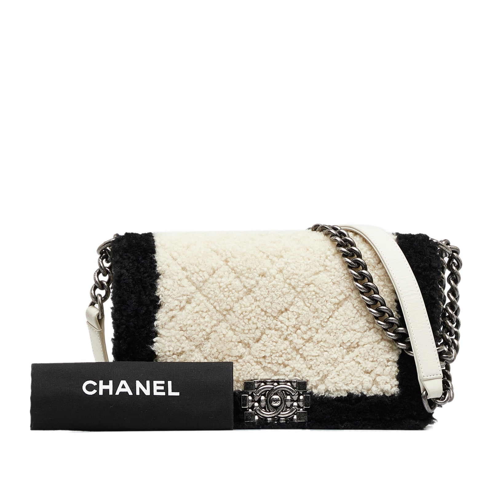 Chanel Old Medium Bicolor Shearling Boy Flap Bag White: Chanel Old Medium Bicolor Shearling Boy Flap Bag White The Chanel Old Medium Bicolor Shearling Boy Flap is a luxurious handbag crafted with a cozy fur body complemented by leather trim. It features a