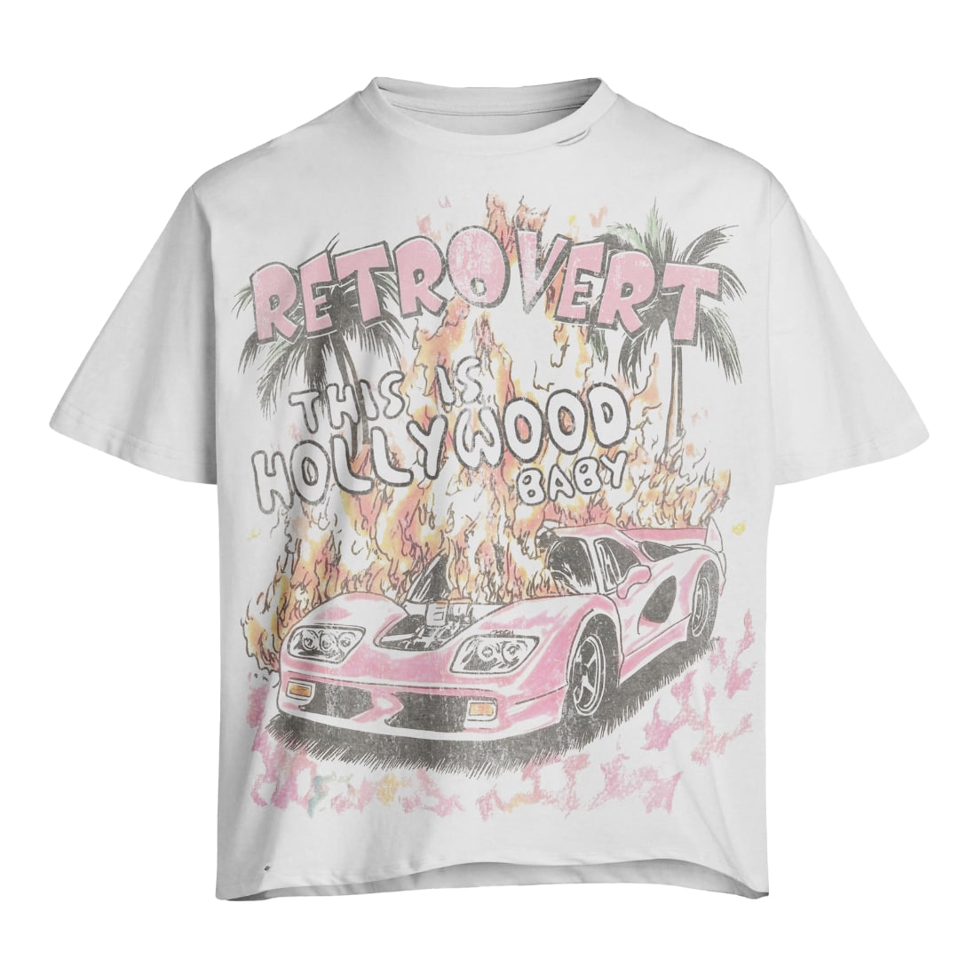 White T-Shirt with Pink Vertical Hollywood Graphic Retro Style Medium: White T-Shirt with Pink Vertical Hollywood Graphic Retro Style Medium This white tee features a bold retro pink "Hollywood" graphic in a vertical layout, offering a vintage-inspired design. Made from