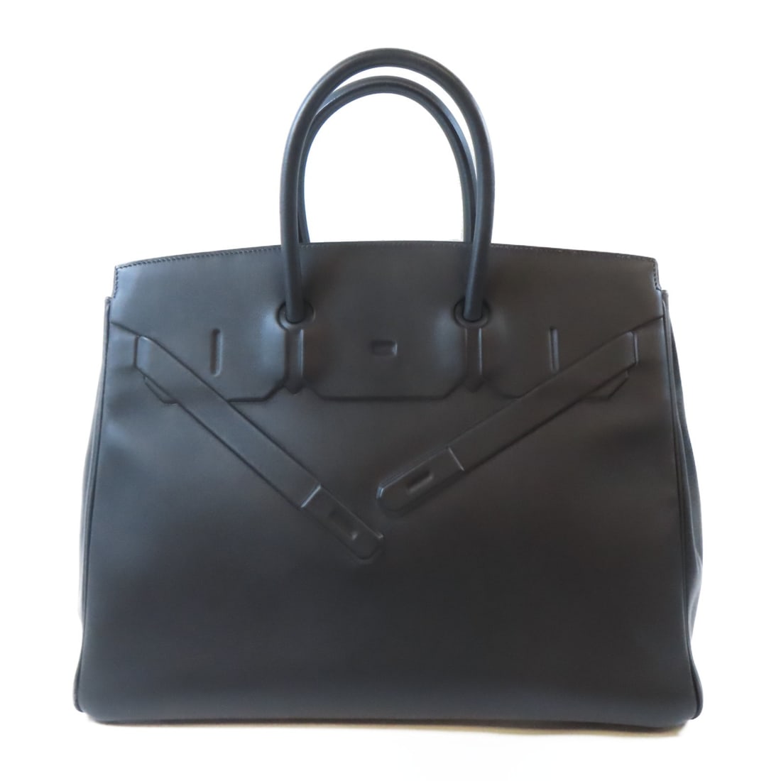 Black Swift Leather Birkin 35 Handbag with Palladium Hardware by Hermes: Black Swift Leather Birkin 35 Handbag with Palladium Hardware by Hermes This Hermes Birkin 35 handbag is crafted from luxurious black Swift calfskin leather and features palladium hardware. Made in Fr
