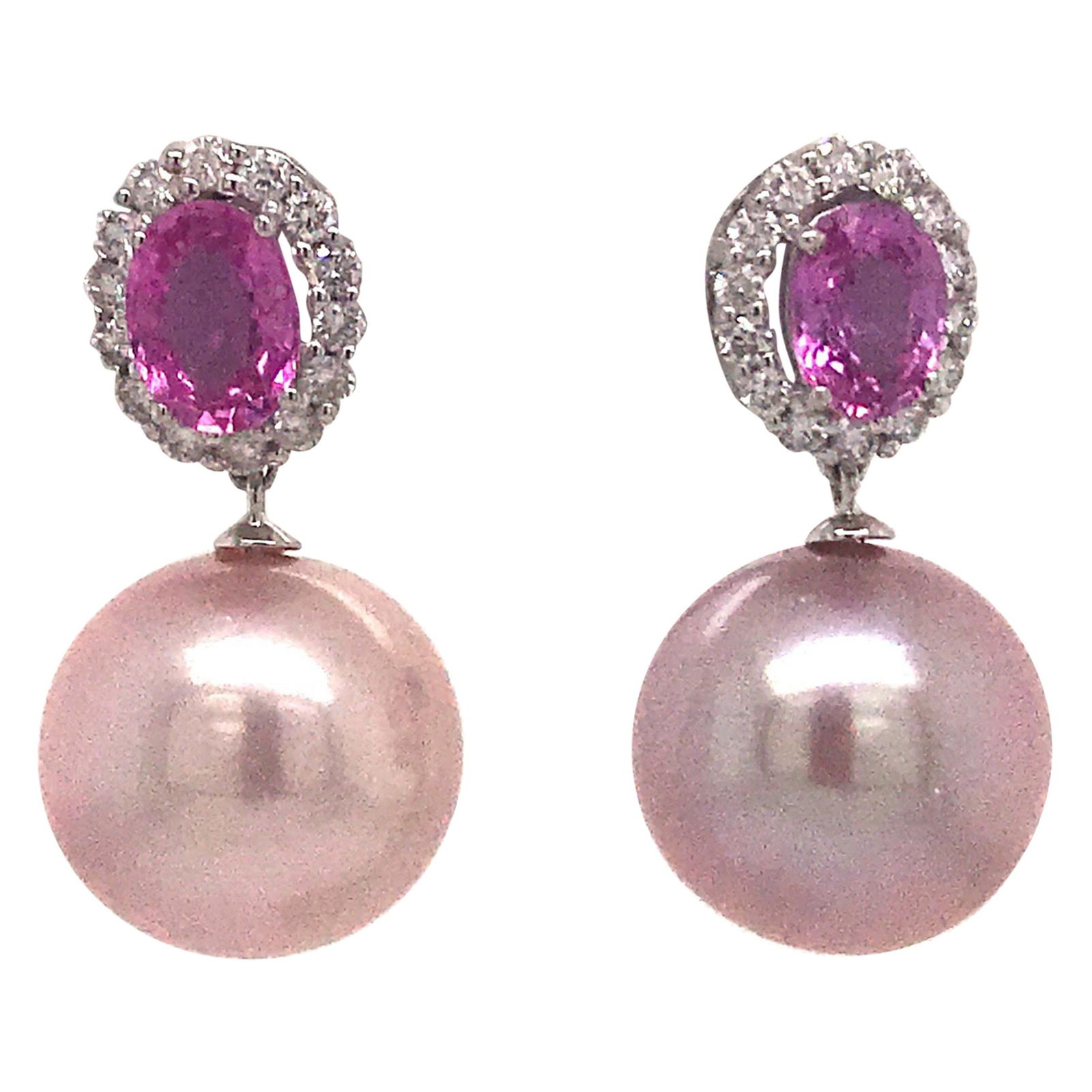 Harbor Diamonds 18K White Gold Pink Sapphire Pearl Drop Earrings: Harbor Diamonds 18K White Gold Pink Sapphire Pearl Drop Earrings Elevate your elegance with these stunning drop earrings crafted in 18K white gold. Each earring features two oval-shaped pink sapphires