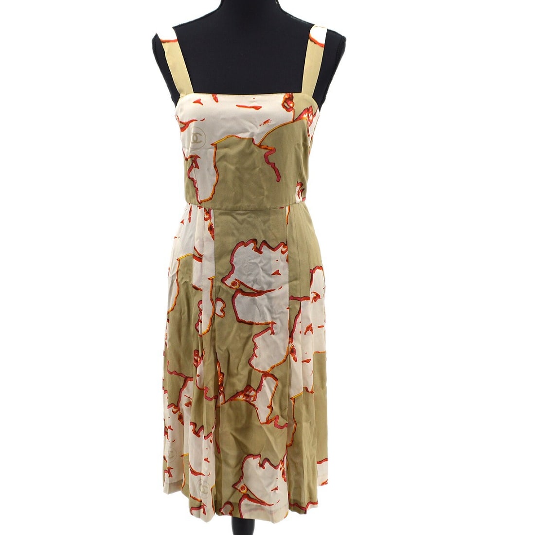 Chanel Vintage 90s Beige Silk Midi Sleeveless Dress Size 38: Chanel Vintage 90s Beige Silk Midi Sleeveless Dress Size 38 Elevate your casual wardrobe with this vintage Chanel sleeveless dress skirt. Crafted from 100% silk, this elegant piece features a midi len