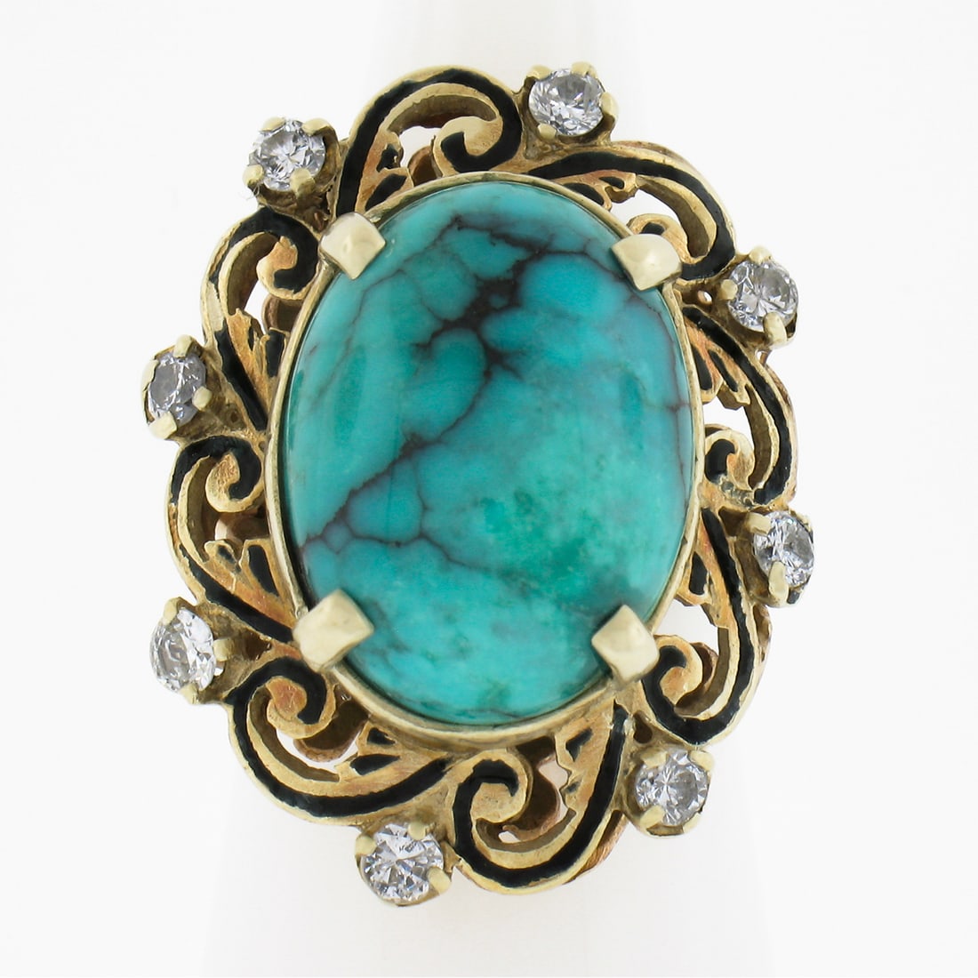 Vintage 14k Gold Turquoise Diamond Enamel Cocktail Ring: Vintage 14k Gold Turquoise Diamond Enamel Cocktail Ring This stunning vintage cocktail ring features a vibrant blue cabochon turquoise stone accented by sparkling diamonds. The main stone is a natural