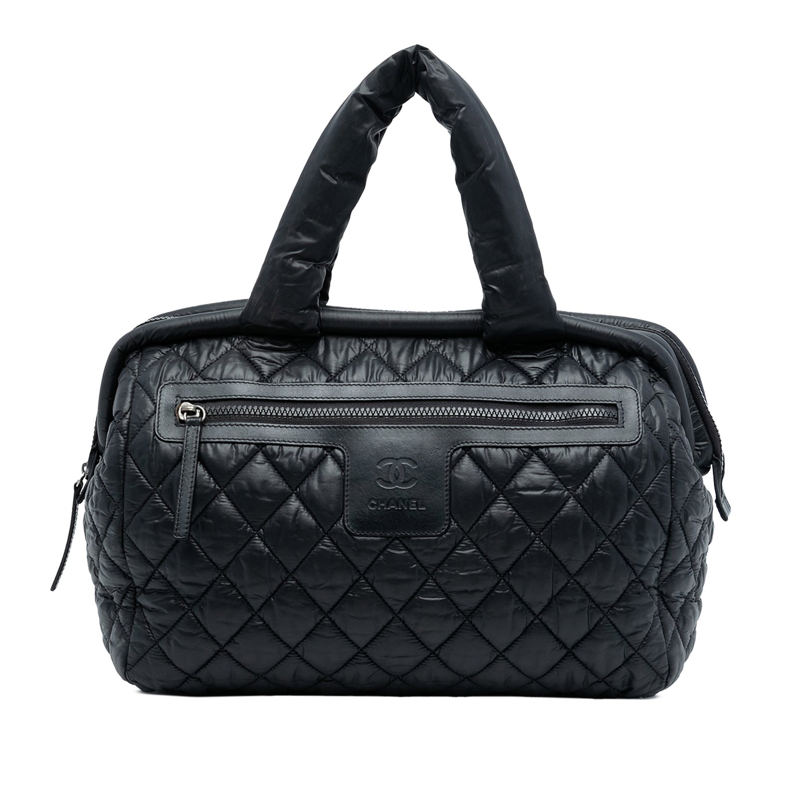 Black Chanel Coco Cocoon Bowler Quilted Nylon Handbag with Top Zip: Black Chanel Coco Cocoon Bowler Quilted Nylon Handbag with Top Zip This Chanel Coco Cocoon Bowler Bag features a quilted nylon exterior in black, rolled handles, a top zip closure, a front exterior zi