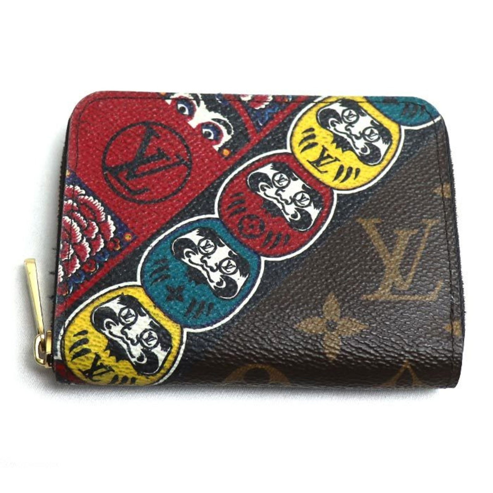 Louis Vuitton Zippy Model Brown Canvas Coin Purse: Louis Vuitton Zippy Model Brown Canvas Coin Purse This Louis Vuitton Zippy coin purse features a brown canvas exterior and is designed for universal use. Made in France, it shows traces of usage with