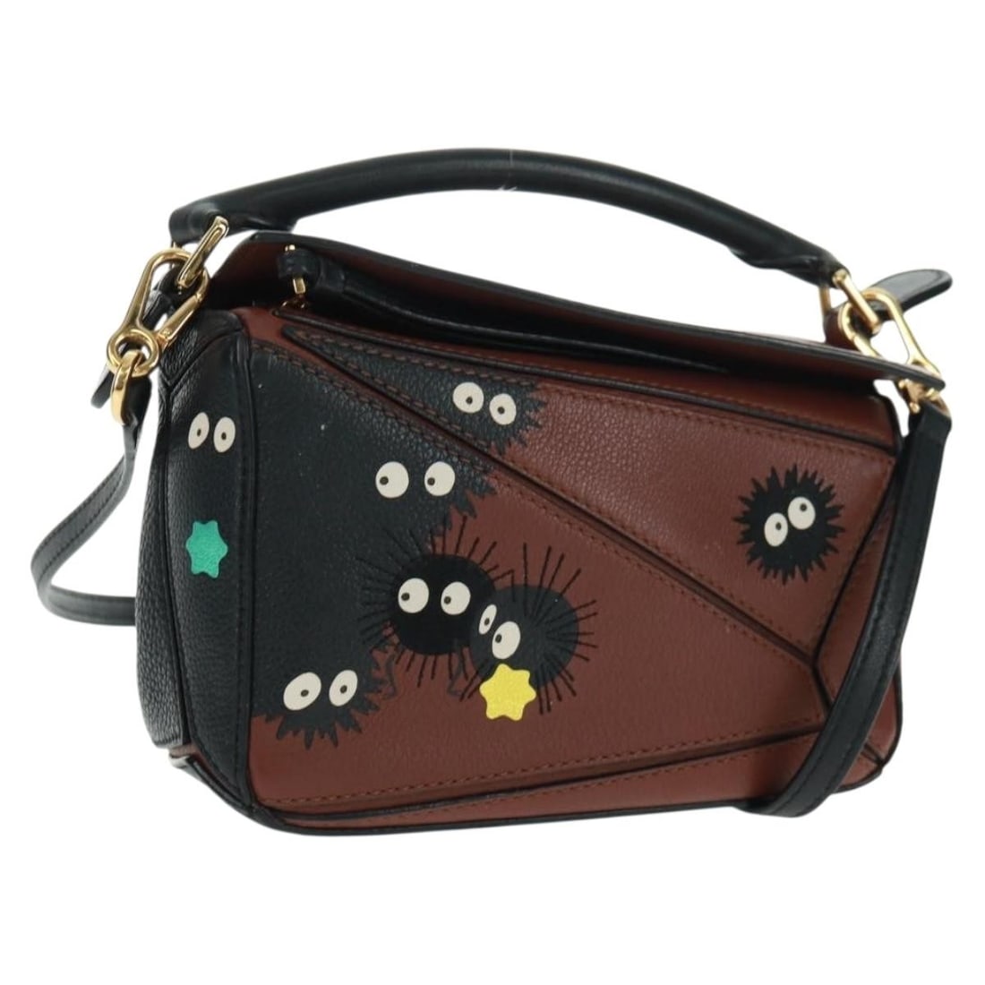 Mini Leather Puzzle Handbag by Loewe with Makkuro Kurosuke Motif Brown 2way: Mini Leather Puzzle Handbag by Loewe with Makkuro Kurosuke Motif Brown 2way The LOEWE Puzzle Bag Mini is a two-way handbag crafted from brown and gold leather. This compact accessory features both a t