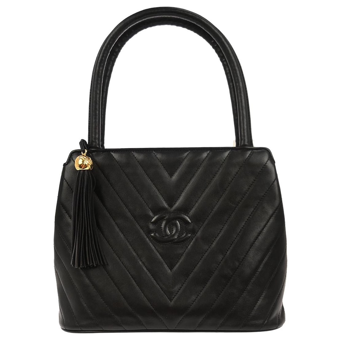 Small Chevron Pattern Chanel Lambskin Top Handle Bag in Black: Small Chevron Pattern Chanel Lambskin Top Handle Bag in Black This Chanel handbag features a black lambskin exterior with a distinctive chevron pattern. Designed in a small size, it is equipped with a