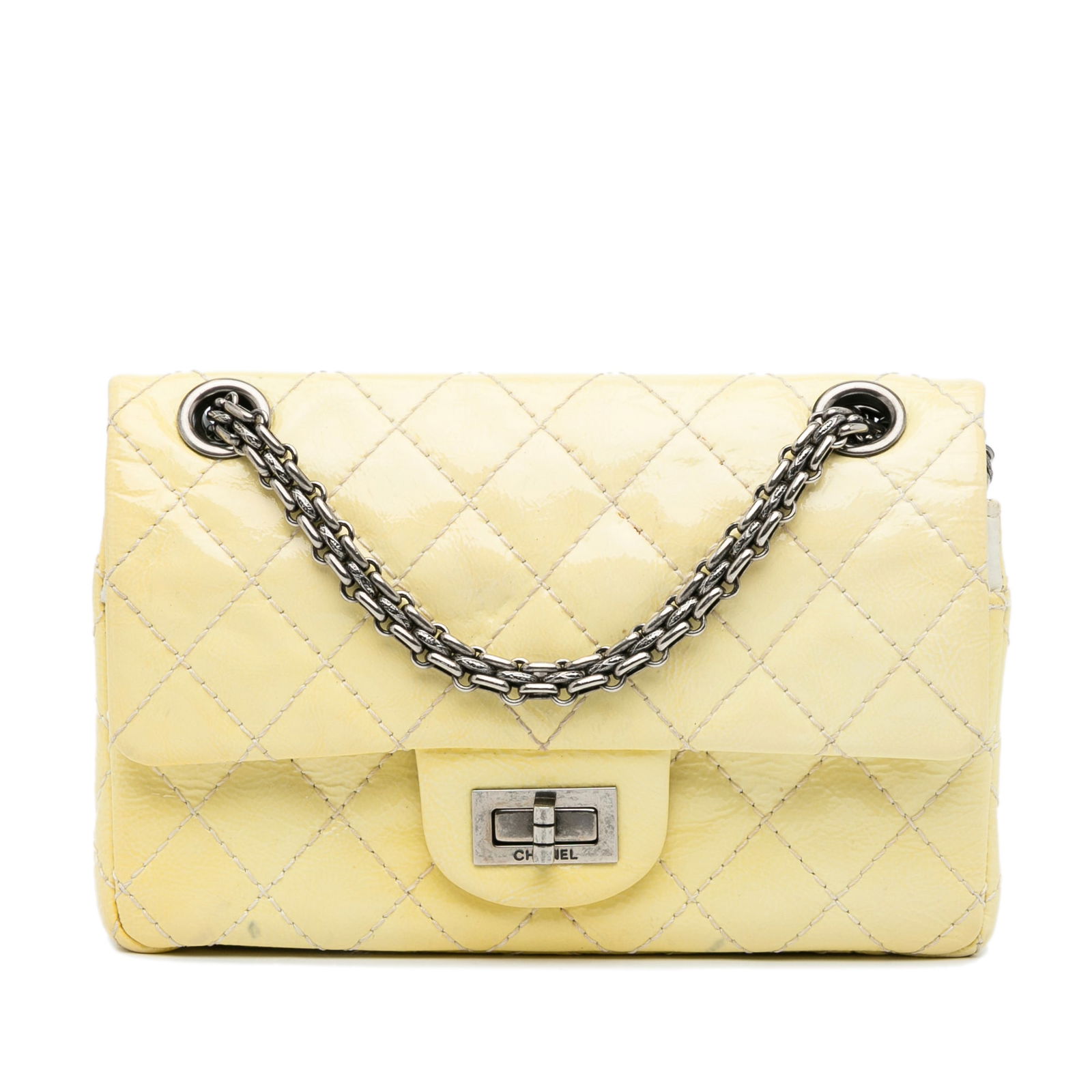 Chanel Mini Reissue 2.55 Patent Double Flap Yellow Bag: Chanel Mini Reissue 2.55 Patent Double Flap Yellow Bag Elevate your accessory collection with the Chanel Mini Reissue 2.55 Patent Double Flap crossbody bag. Crafted from quilted patent leather, this b