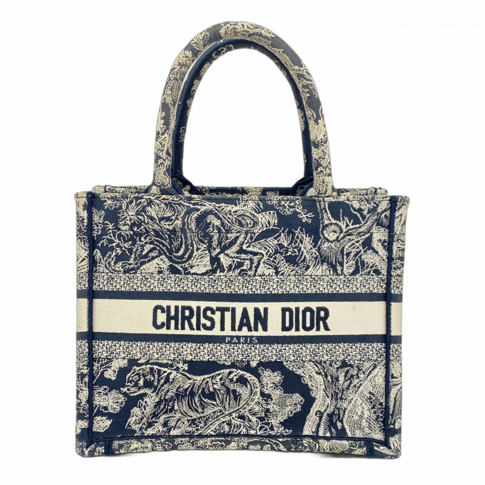 Dior Navy Canvas Book Tote Handbag from Italy: Dior Navy Canvas Book Tote Handbag from Italy This Dior Book Tote is crafted from navy canvas and designed for women. Made in Italy, the bag measures 21.5cm x 26.5cm x 14cm (8.46'' x 10.43'' x 5.51'')