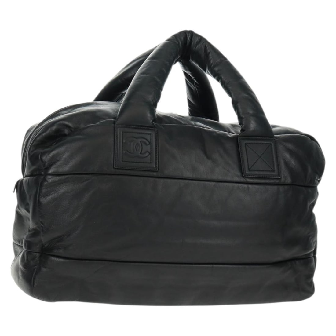 Black Leather Boston Bag by CHANEL with Silver CC Accents: Black Leather Boston Bag by CHANEL with Silver CC Accents This CHANEL Boston Bag features a classic black leather exterior with silver-tone accents. Crafted in Italy, it offers a spacious main compart