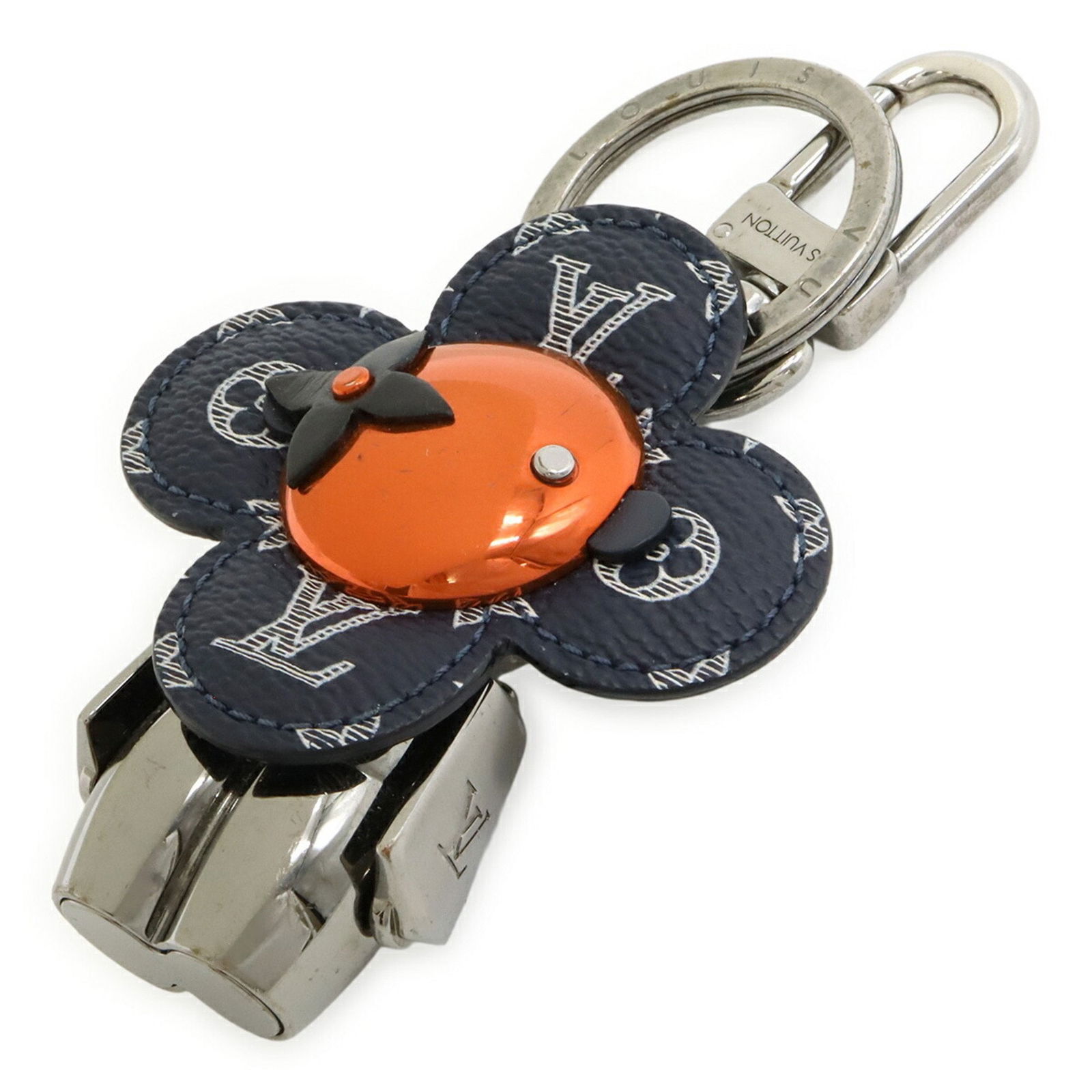 Silver Metal Porte Cles Key Holder by Louis Vuitton: Silver Metal Porte Cles Key Holder by Louis Vuitton This Louis Vuitton Porte cles key holder features a silver-tone metal design and is suitable for any gender. It displays some signs of use, includin