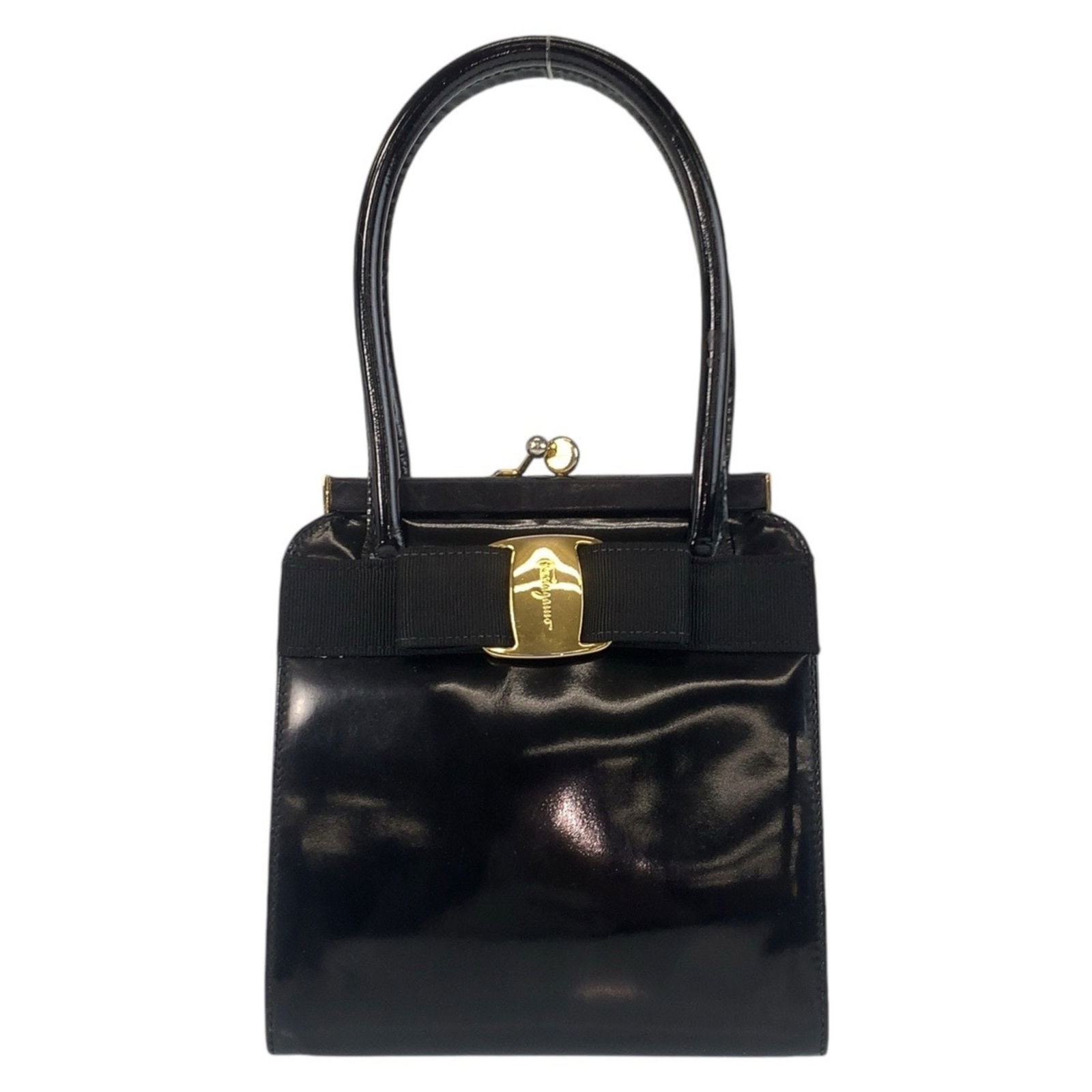Salvatore Ferragamo Vara Black Patent Leather Handbag 18cm: Salvatore Ferragamo Vara Black Patent Leather Handbag 18cm This Salvatore Ferragamo Vara handbag is crafted from black patent leather and features a classic, elegant design. The bag includes a top han