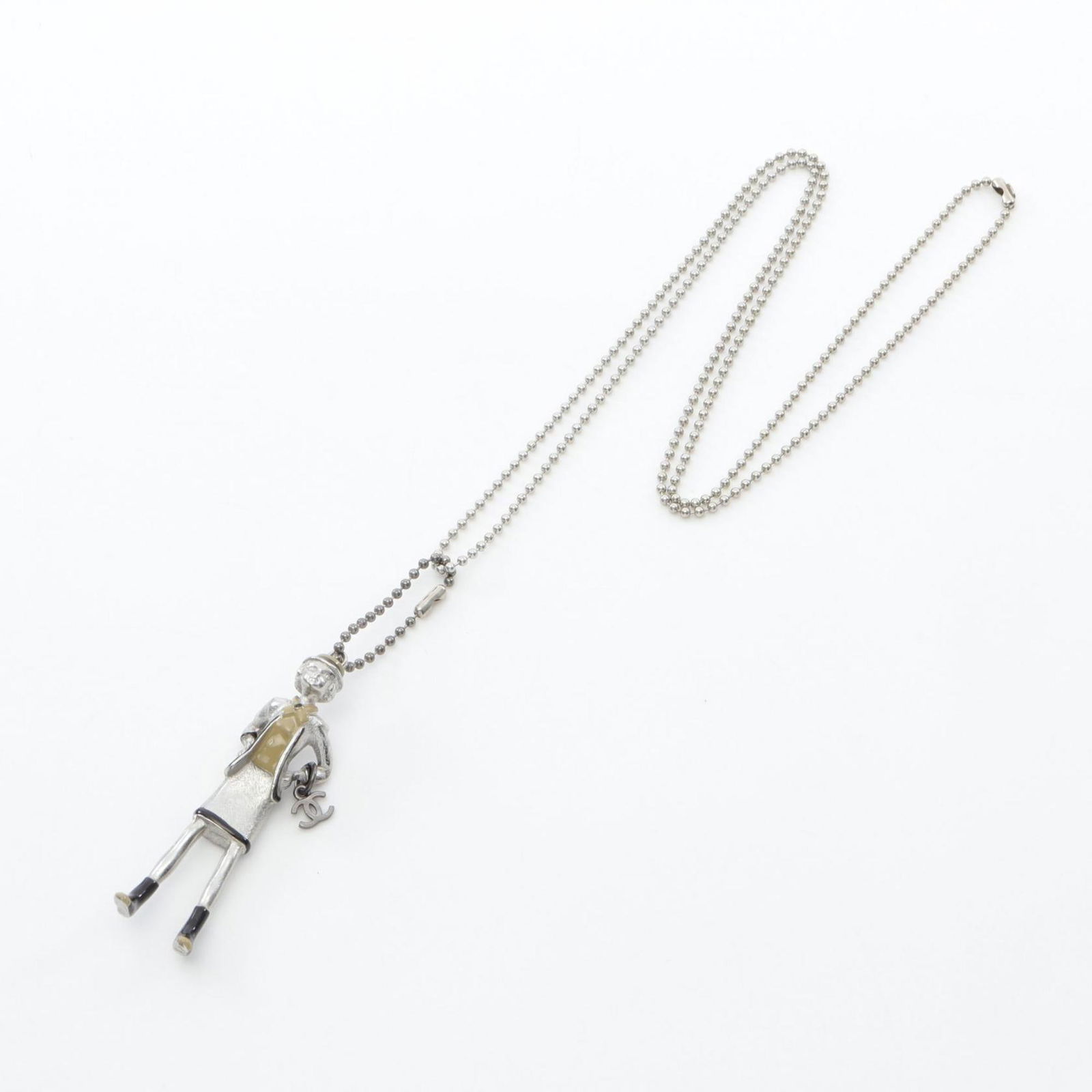 Chanel Mademoiselle Steel Necklace with Silver Tone Pendant: Chanel Mademoiselle Steel Necklace with Silver Tone Pendant This is a Chanel Mademoiselle necklace designed for women, featuring a silver-tone steel construction. The necklace includes a prominent pen