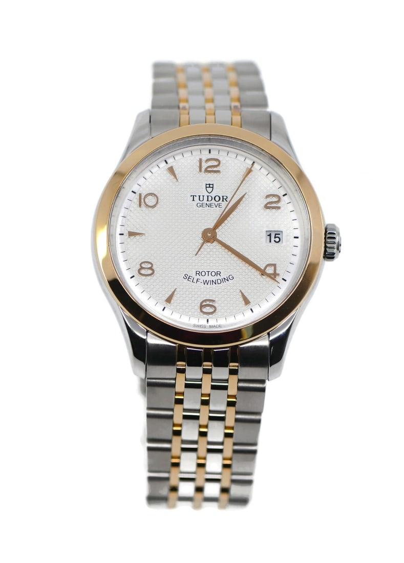 Tudor 1926 Automatic 18K Gold Stainless Steel Watch 91451 with Box and Papers: Tudor 1926 Automatic 18K Gold Stainless Steel Watch 91451 with Box and Papers This exquisite Tudor 1926 wristwatch is a blend of elegance and functionality, featuring a mechanical (automatic) movement