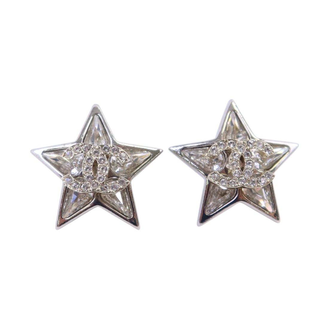 CHANEL Silver CC Strass Pierced Earrings ABA911 C23S: CHANEL Silver CC Strass Pierced Earrings ABA911 C23S These CHANEL pierced earrings feature the signature CC logo design in silver-tone metal with strass embellishments. Crafted in France, they offer a