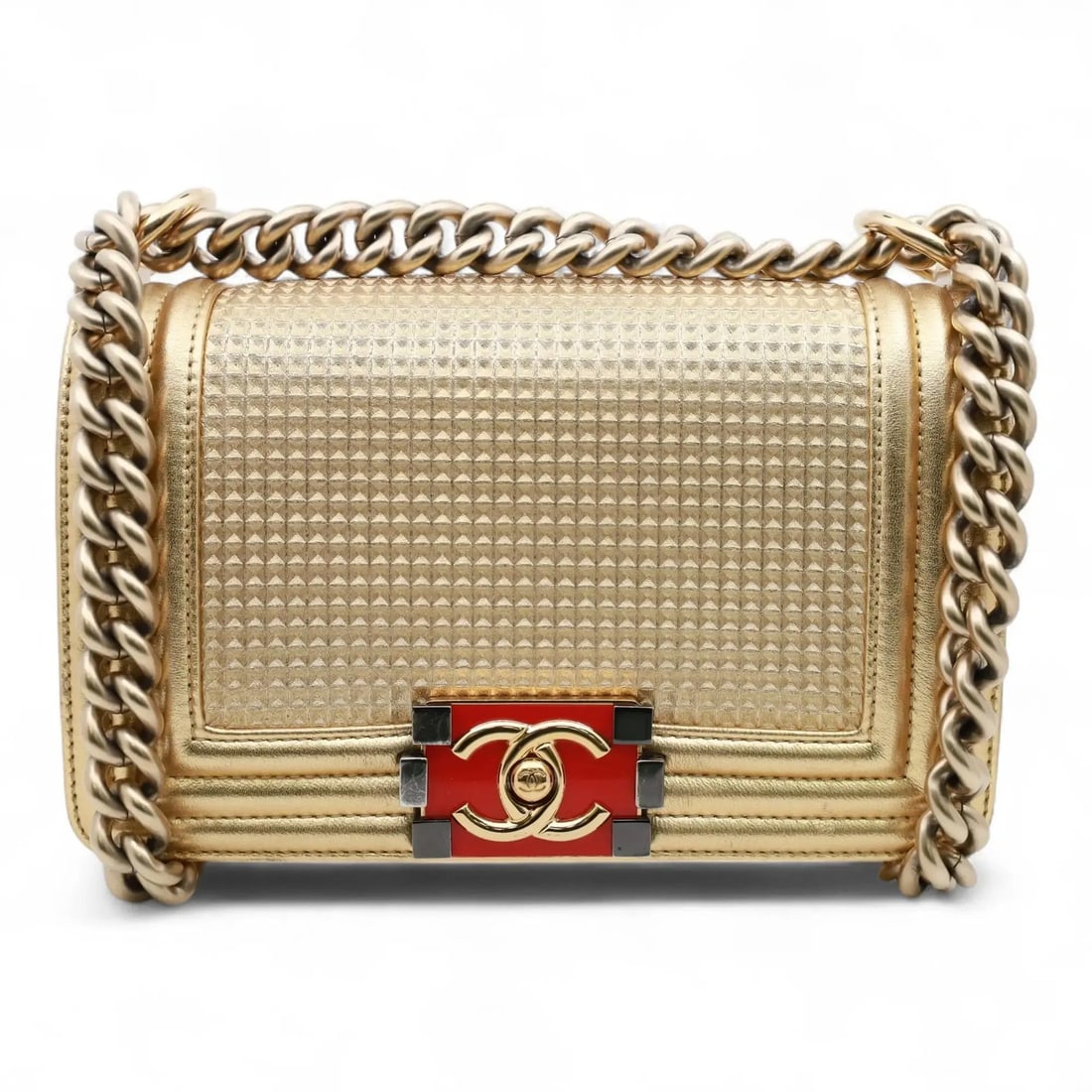 Small Chanel Boy Gold Cube Embossed Leather Crossbody Flap Bag: Small Chanel Boy Gold Cube Embossed Leather Crossbody Flap Bag This Chanel Boy Small Flap Crossbody bag features metallic gold cube-embossed leather with a flap design. The front is adorned with a red