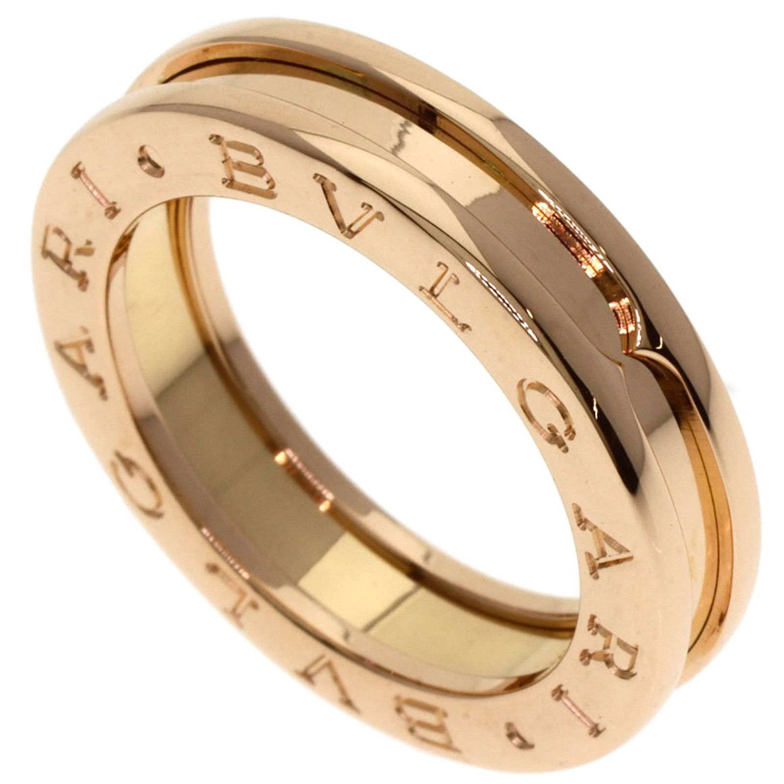 Rose Gold B.Zero1 Ring by Bulgari Size 5 Made in Italy: Rose Gold B.Zero1 Ring by Bulgari Size 5 Made in Italy This Bulgari B.Zero1 ring features a sleek design crafted from rose gold. The unisex piece is presented in gold color and originates from Italy.