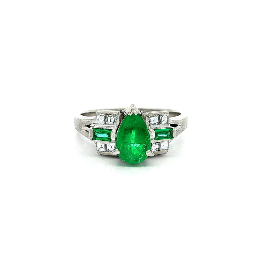 Platinum 1.66ctw Pear Emerald and Asscher Diamond Ring: Platinum 1.66ctw Pear Emerald and Asscher Diamond Ring This exquisite cocktail engagement ring features a stunning design crafted in solid platinum, weighing 6.7 grams. The centerpiece is a vibrant gr