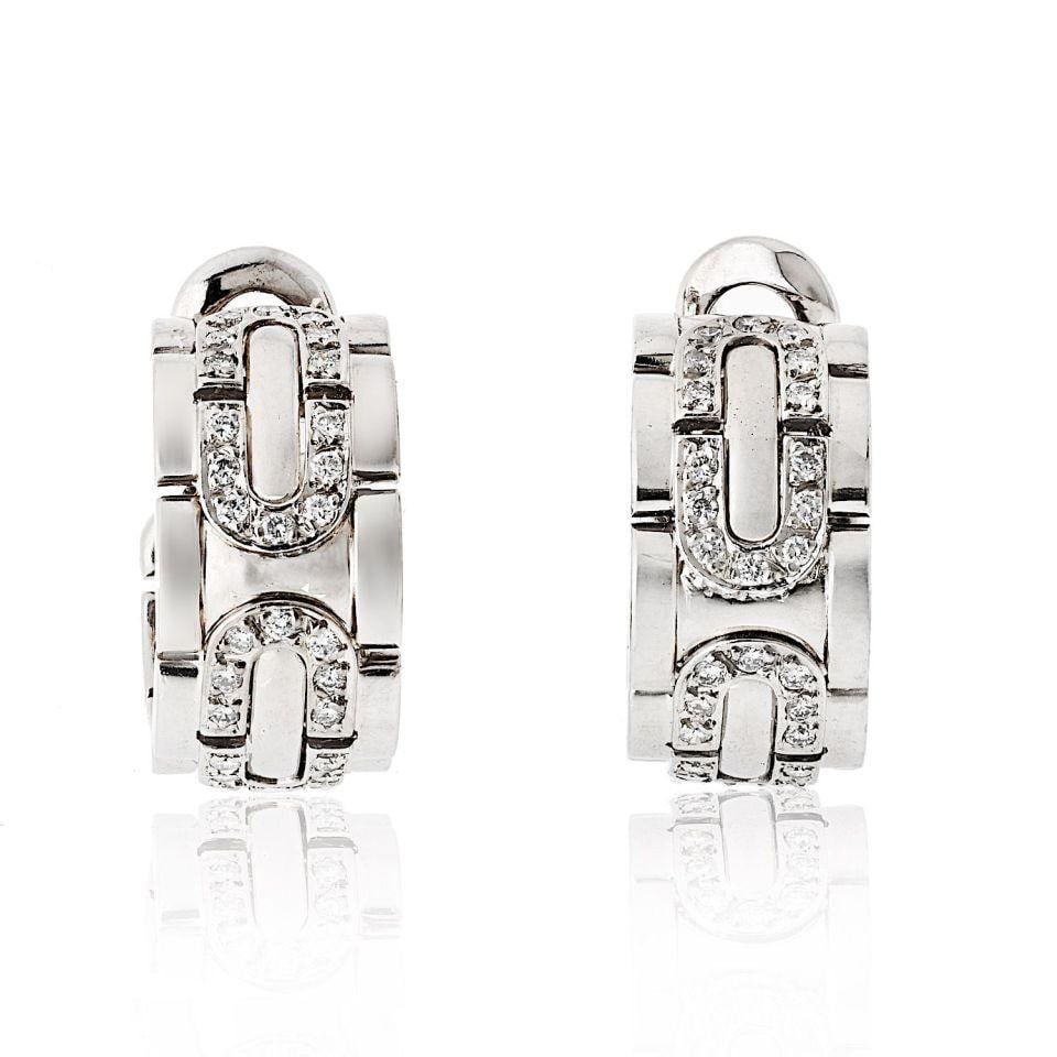 Cartier 18K White Gold Diamond Hoop Earrings Clip-On: Cartier 18K White Gold Diamond Hoop Earrings Clip-On Exquisite Cartier hoop earrings crafted in luxurious 18K white gold, weighing 27.6 grams. These earrings feature a classic clip-on design, ensuring
