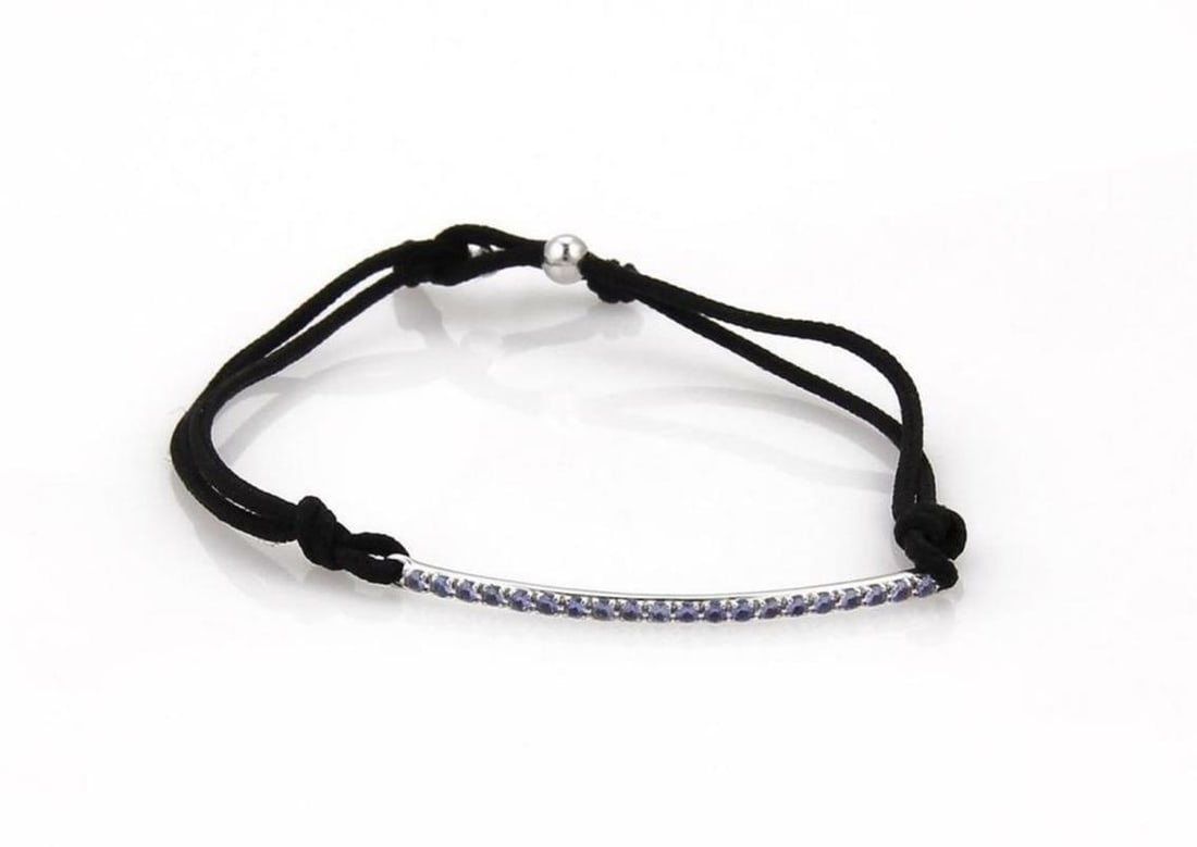 Tiffany & Co. Metro Iolite 18k White Gold Bar Bracelet with Black Cord: Tiffany & Co. Metro Iolite 18k White Gold Bar Bracelet with Black Cord Discover the elegance of this authentic Tiffany & Co. Metro Iolite Bracelet, exquisitely crafted from 18k white gold with a polis