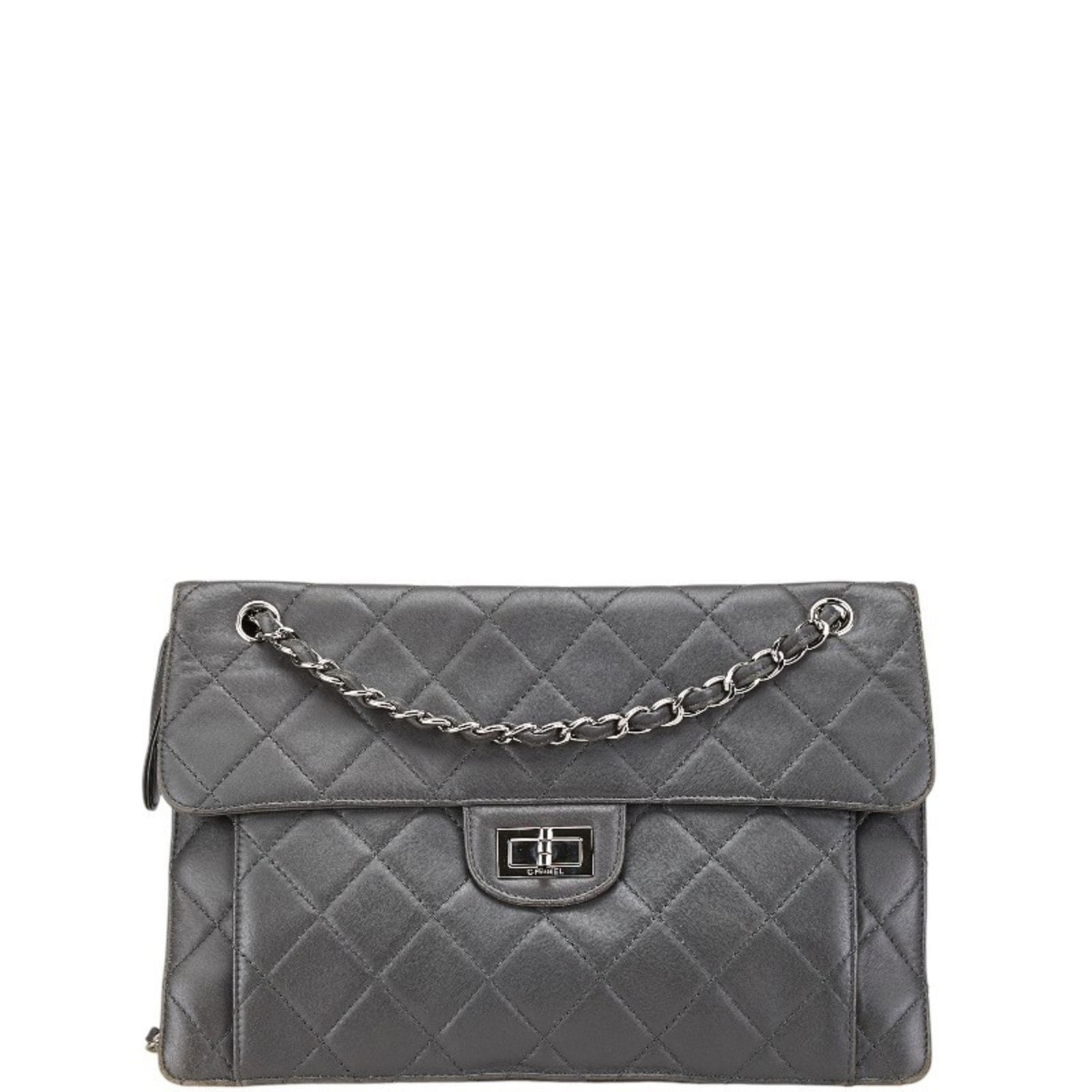 Grey Leather Chanel 2.55 Shoulder Bag 23cm x 33cm x 7.5cm: Grey Leather Chanel 2.55 Shoulder Bag 23cm x 33cm x 7.5cm This Chanel 2.55 handbag is crafted from grey leather and features classic styling. The bag has a gently used appearance, with a slightly out-
