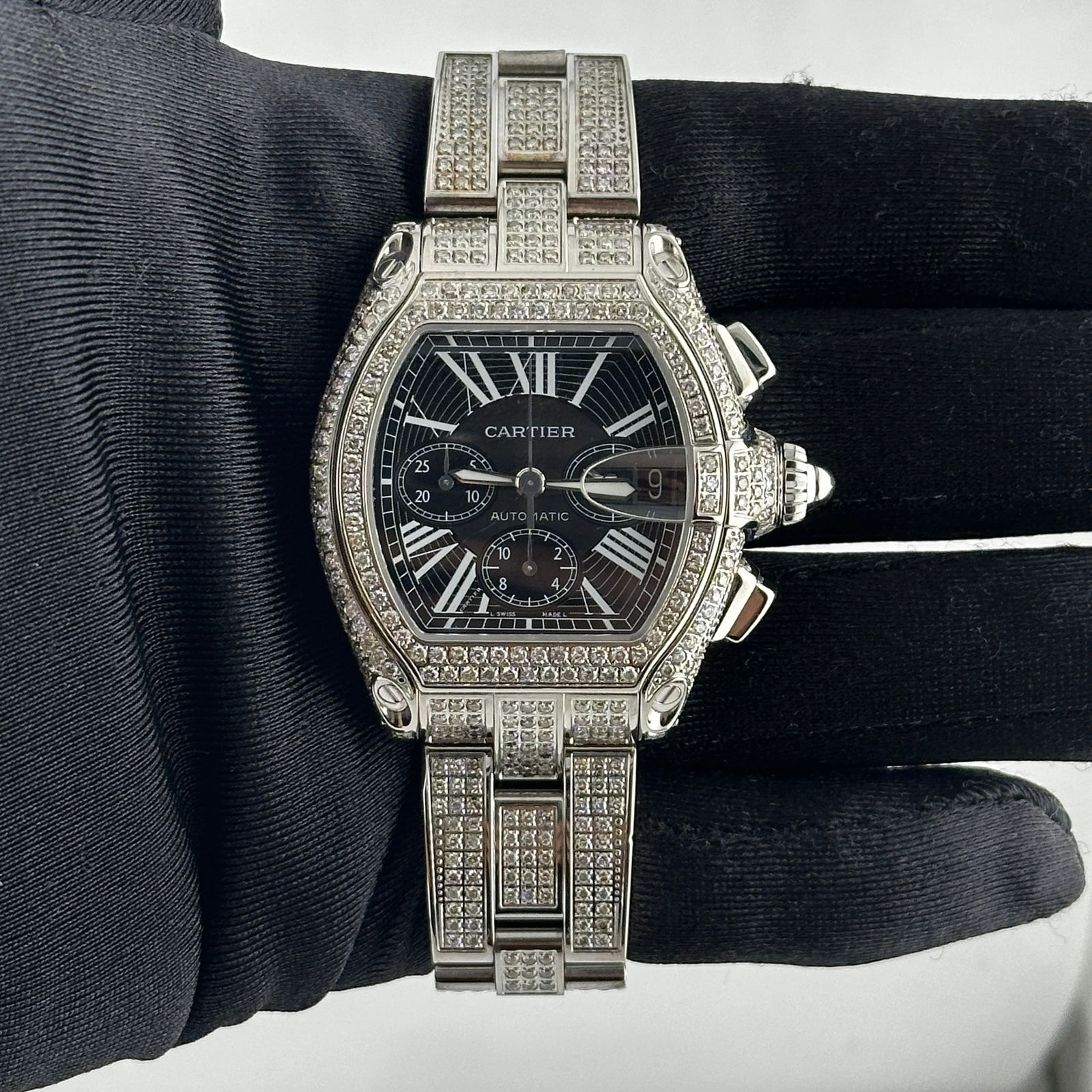Cartier Roadster XL Reference 2618 Diamond Bezel and Bracelet Men's Chronograph: Cartier Roadster XL Reference 2618 Diamond Bezel and Bracelet Men's Chronograph This Cartier Roadster XL features a black Roman chronograph dial, complemented by a diamond bezel and diamond bracelet.