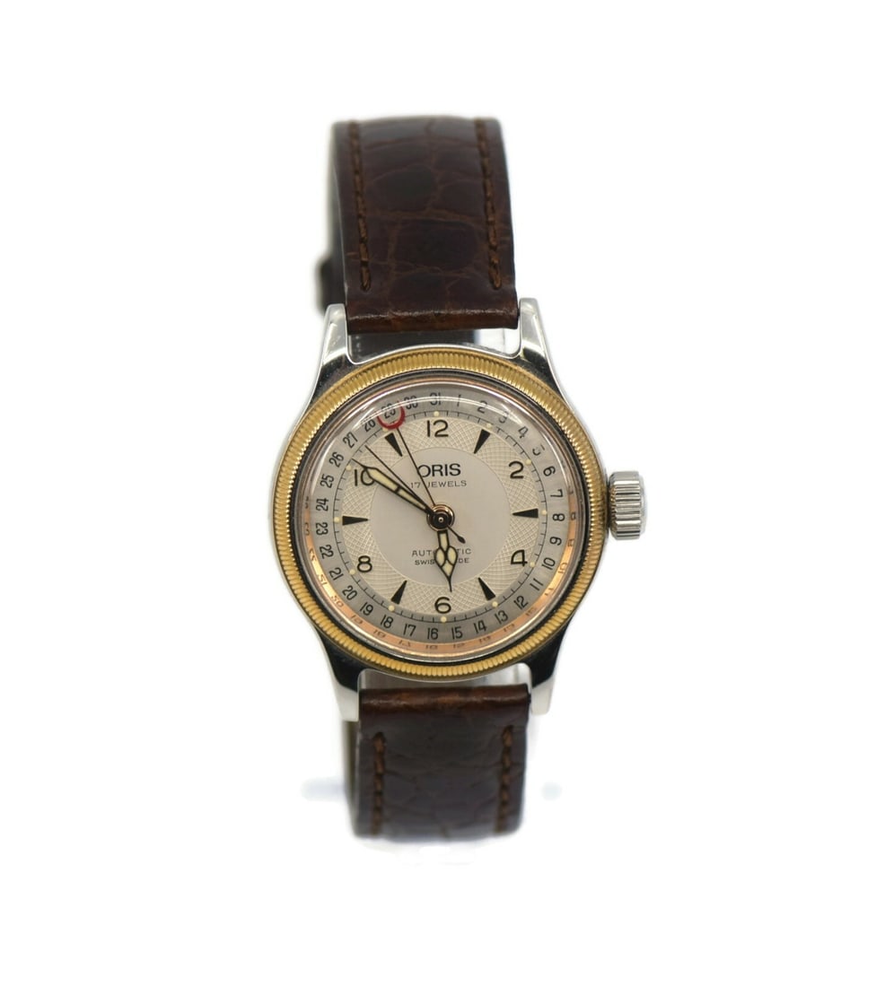 Oris Two Tone Stainless Steel Automatic Wristwatch with Brown Leather Band: Oris Two Tone Stainless Steel Automatic Wristwatch with Brown Leather Band This elegant Oris Two Tone Stainless Steel Watch features a durable stainless steel case with a mechanical (automatic) moveme