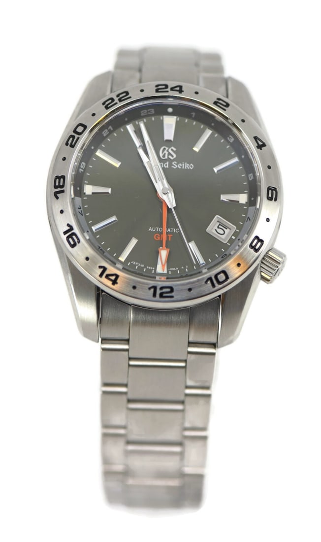 Grand Seiko Sport GMT Stainless Steel SBGM247 with Box and Papers: Grand Seiko Sport GMT Stainless Steel SBGM247 with Box and Papers The Grand Seiko Sport GMT SBGM247 is a stunning stainless steel wristwatch featuring a 40mm case and a striking green band. This mecha