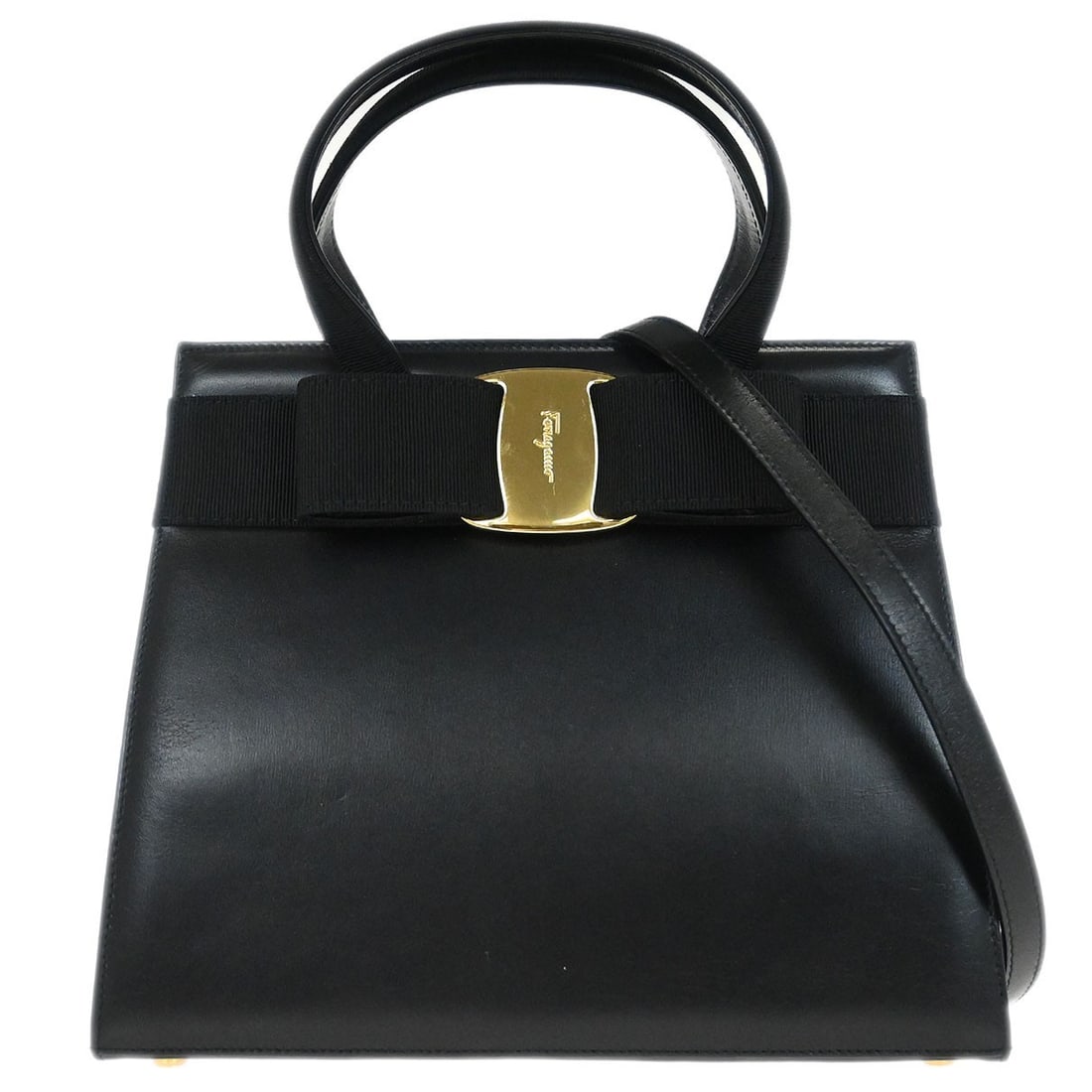 Black Leather Vara Bow Two Way Top Handle Bag by Salvatore Ferragamo: Black Leather Vara Bow Two Way Top Handle Bag by Salvatore Ferragamo This Salvatore Ferragamo Vara Bow 2-way handbag features a black leather exterior accented with the signature Vara bow and logo det
