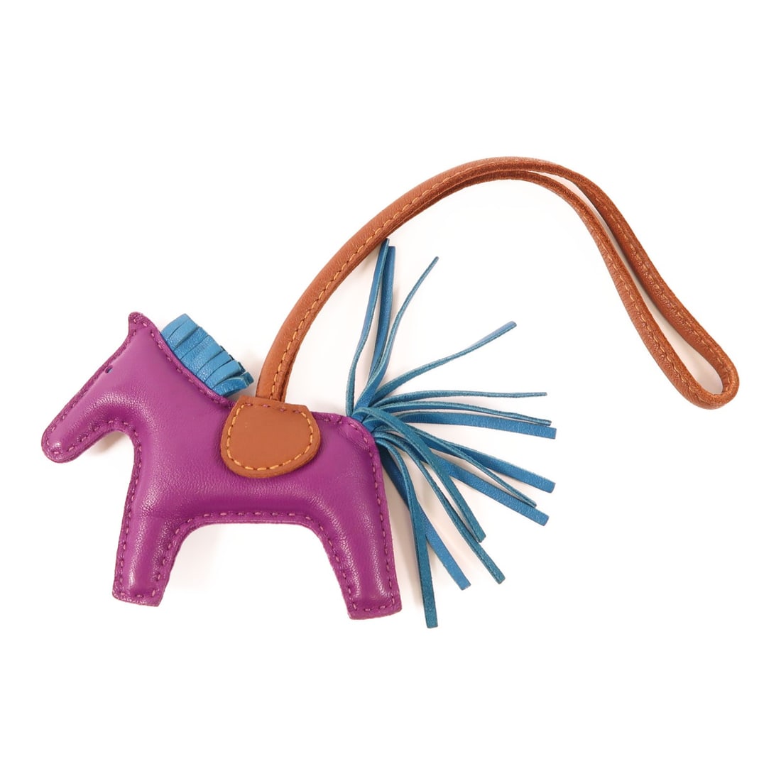 HERMES Rodeo PM Charm Calfskin Leather Brown Purple: HERMES Rodeo PM Charm Calfskin Leather Brown Purple This HERMES Rodeo PM Charm is crafted from exquisite calfskin (cowhide) leather in a rich brown color, complemented by a vibrant purple accent. It s