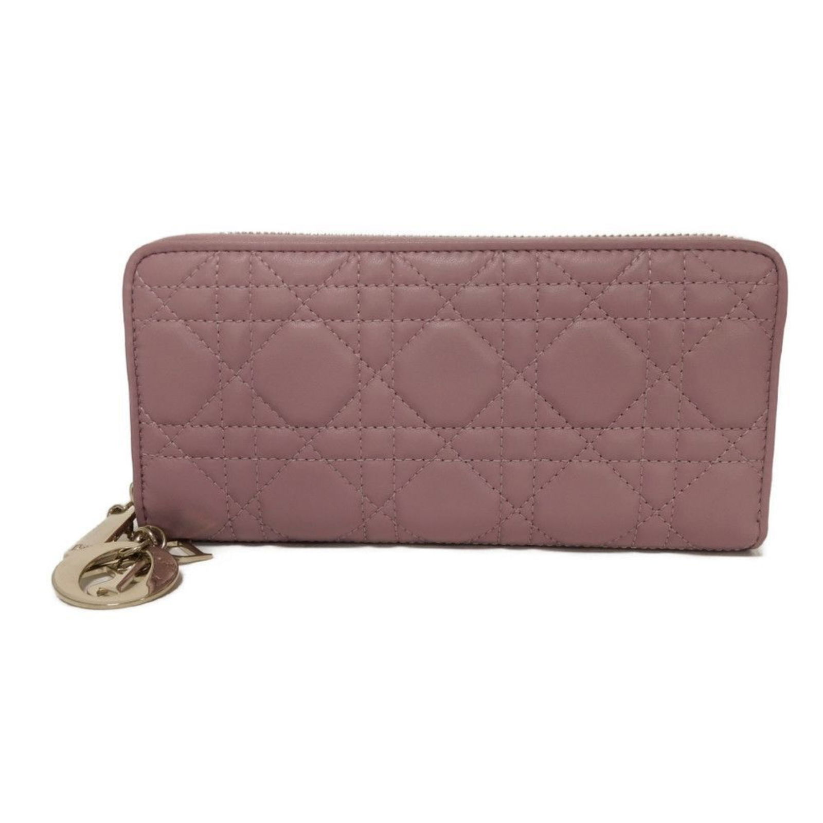 Purple Leather Lady Dior Wallet by Dior France: Purple Leather Lady Dior Wallet by Dior France This Dior Lady Dior clutch is crafted from purple leather and features a compact, elegant design. Made in France, it is tailored for women and offers a r