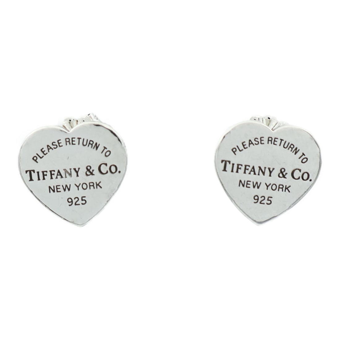 Pierced Heart Earrings in 925 Silver by TIFFANY&CO: Pierced Heart Earrings in 925 Silver by TIFFANY&CO These Tiffany & Co. heart-shaped pierced earrings are crafted from 925 silver, offering a timeless and elegant accessory. Made in the United States,